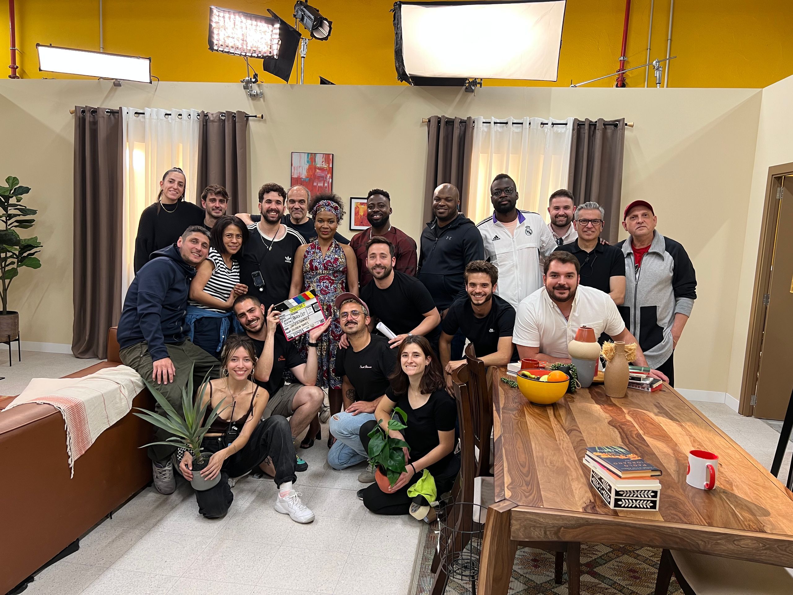 Javier Ramírez with the cast and crew of Nigerian Wedding on the living room set