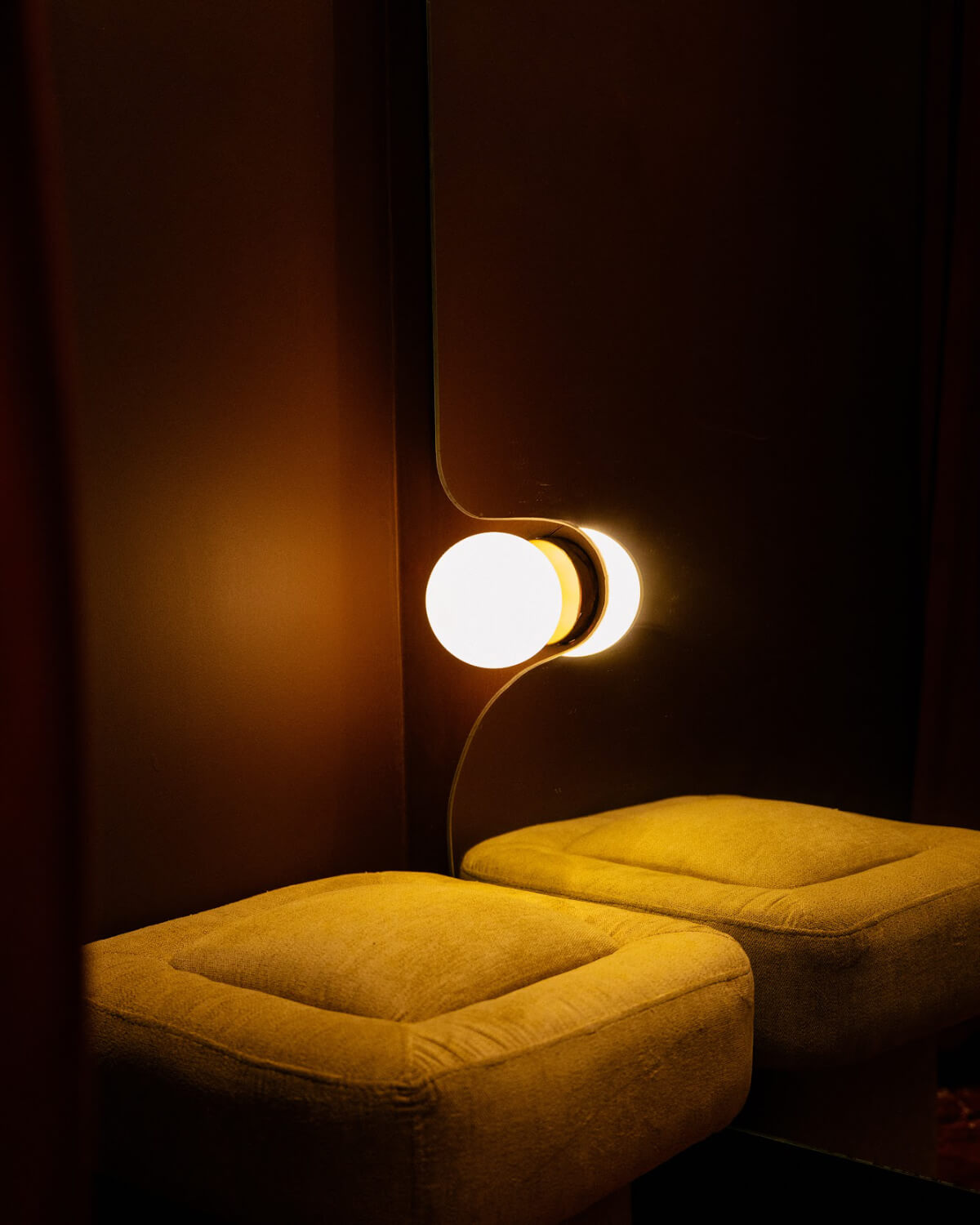 a living room with a tv and chairs