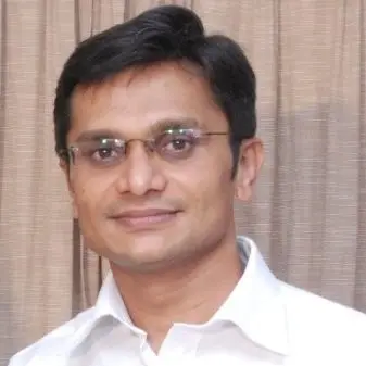Man in glasses and white shirt.