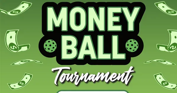 A woman with short brown hair, wearing a floral orange dress, sits at a news desk. She looks serious. Blurred cityscape and cameras surround her.