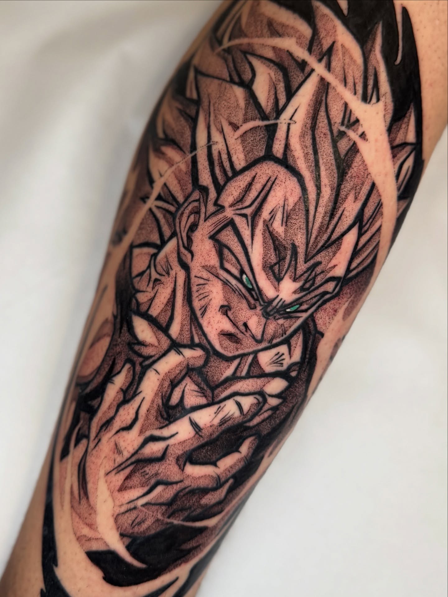 A forearm tattoo of Nezuko Kamado from Demon Slayer, depicted in a stylized anime art style. She is holding a sword.