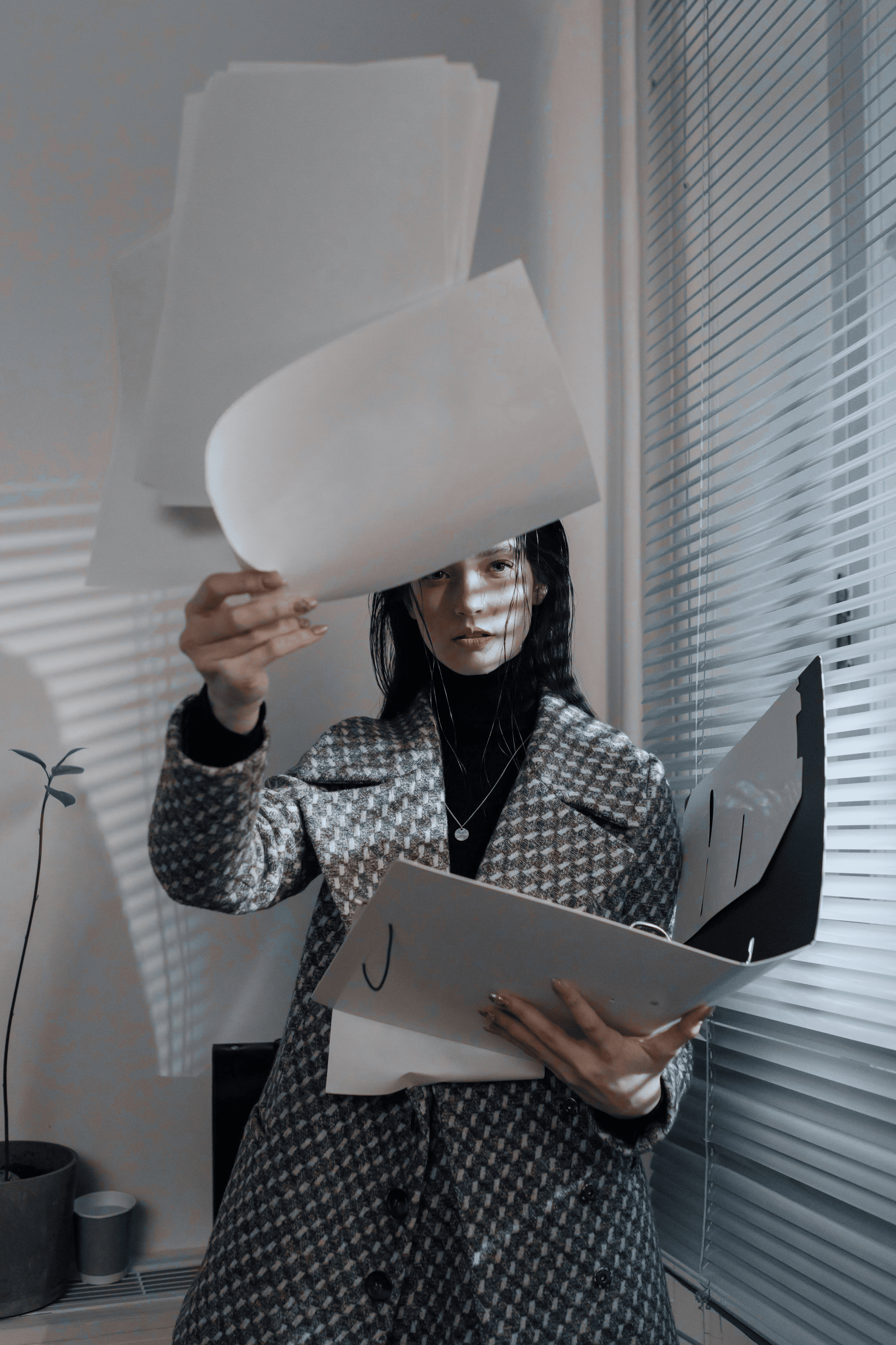 Lady holding files | We Are Auntie