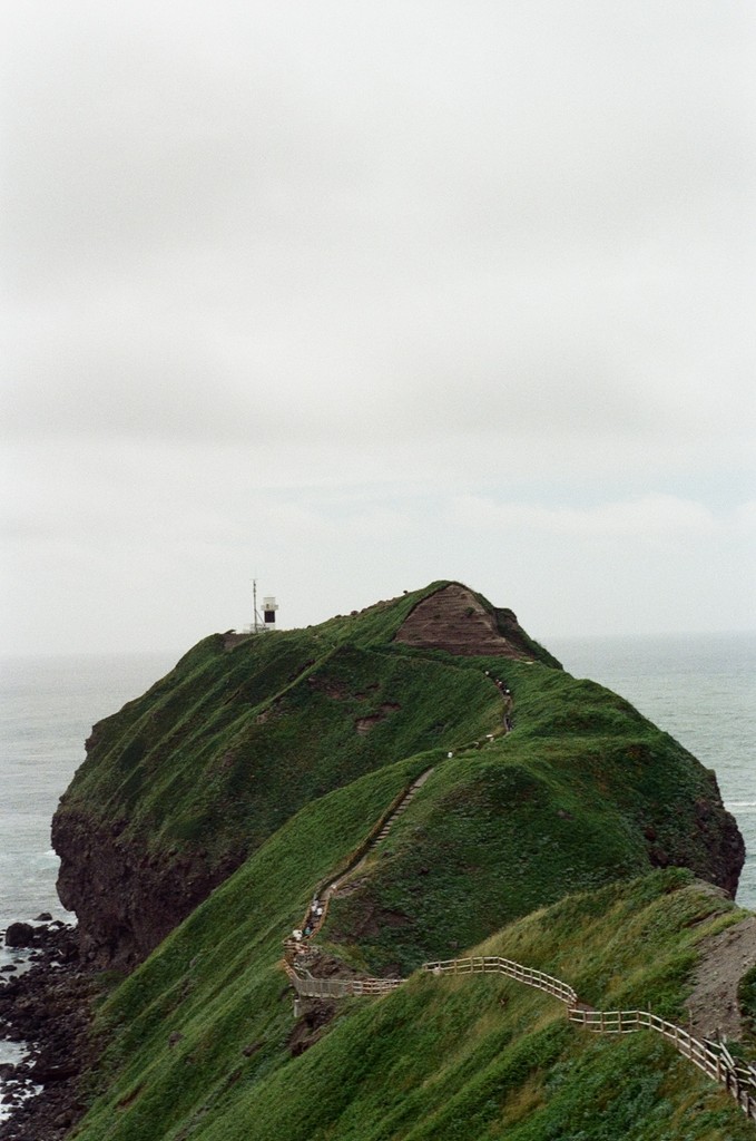 a cell phone leaning on a ledge
