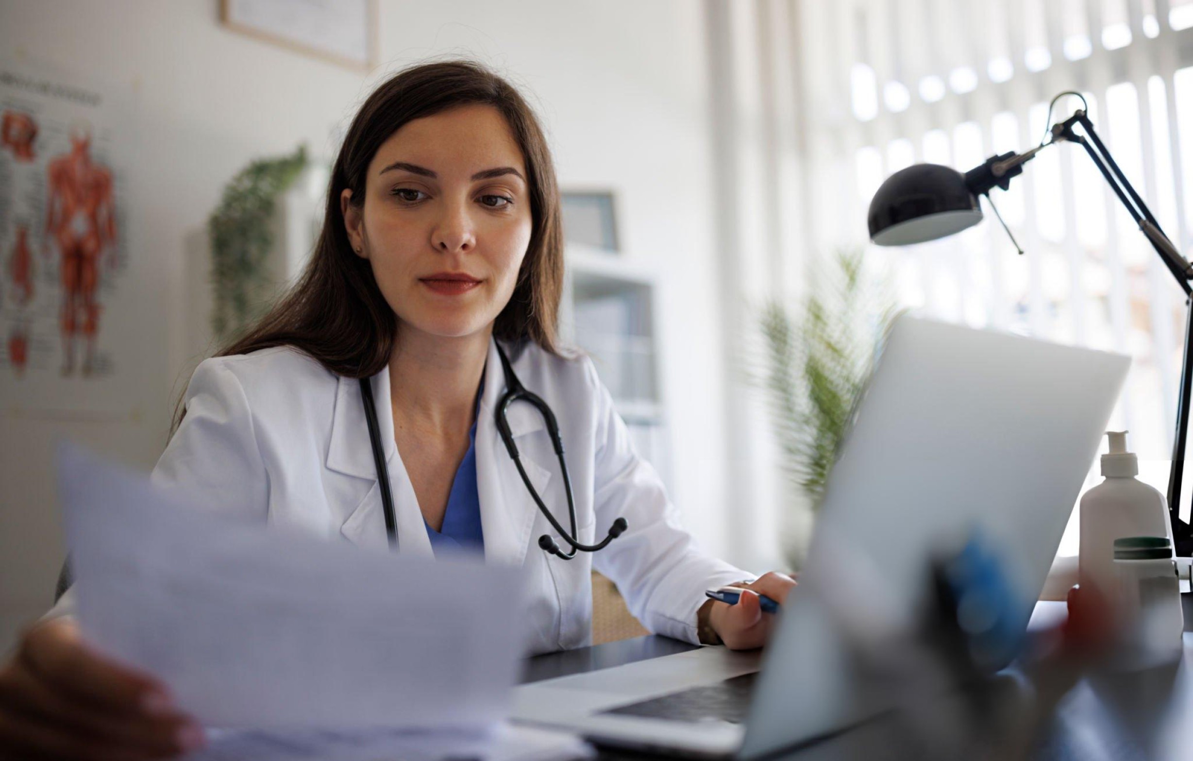 two people looking at a tablet and smiling