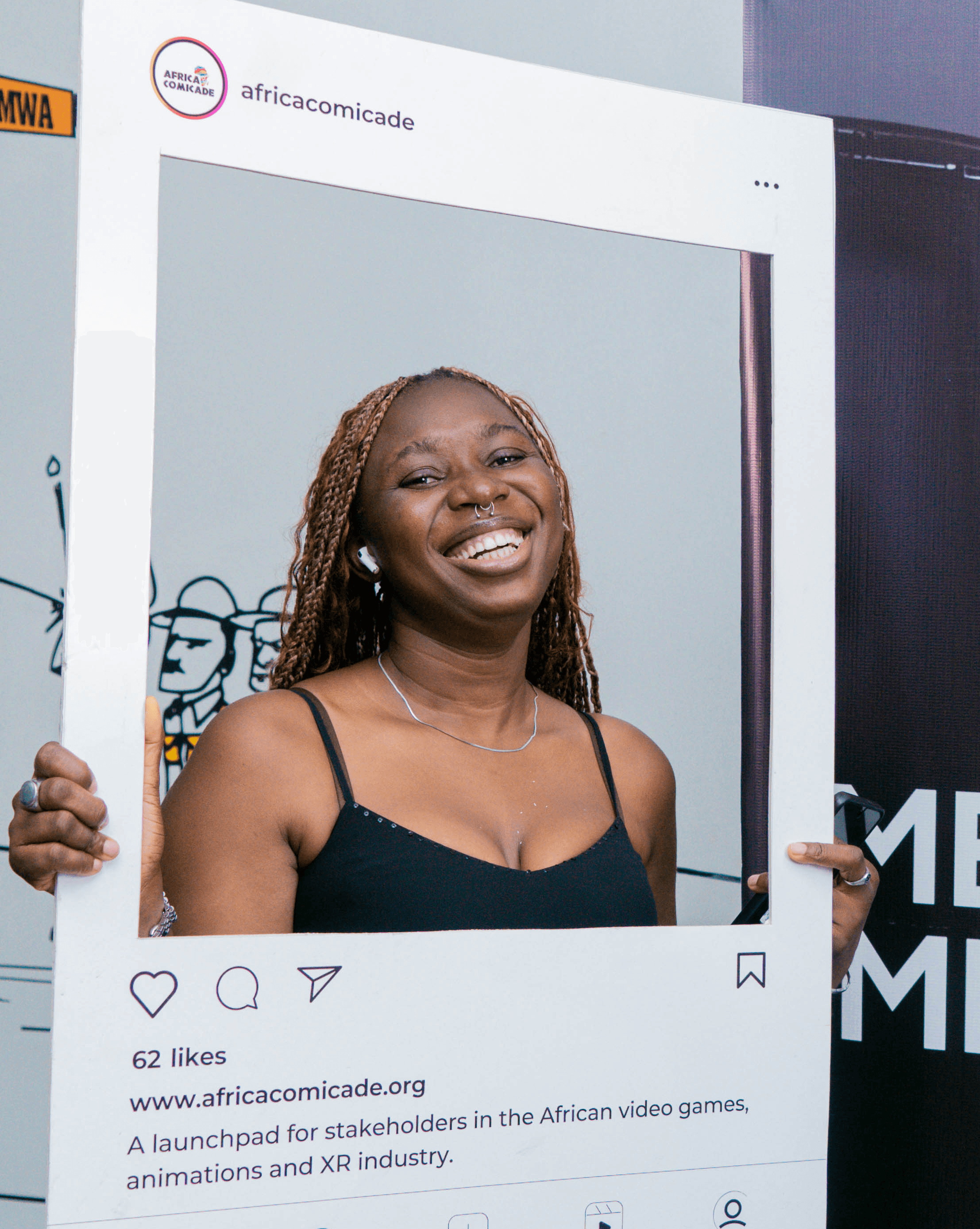 woman in black with a cutout board