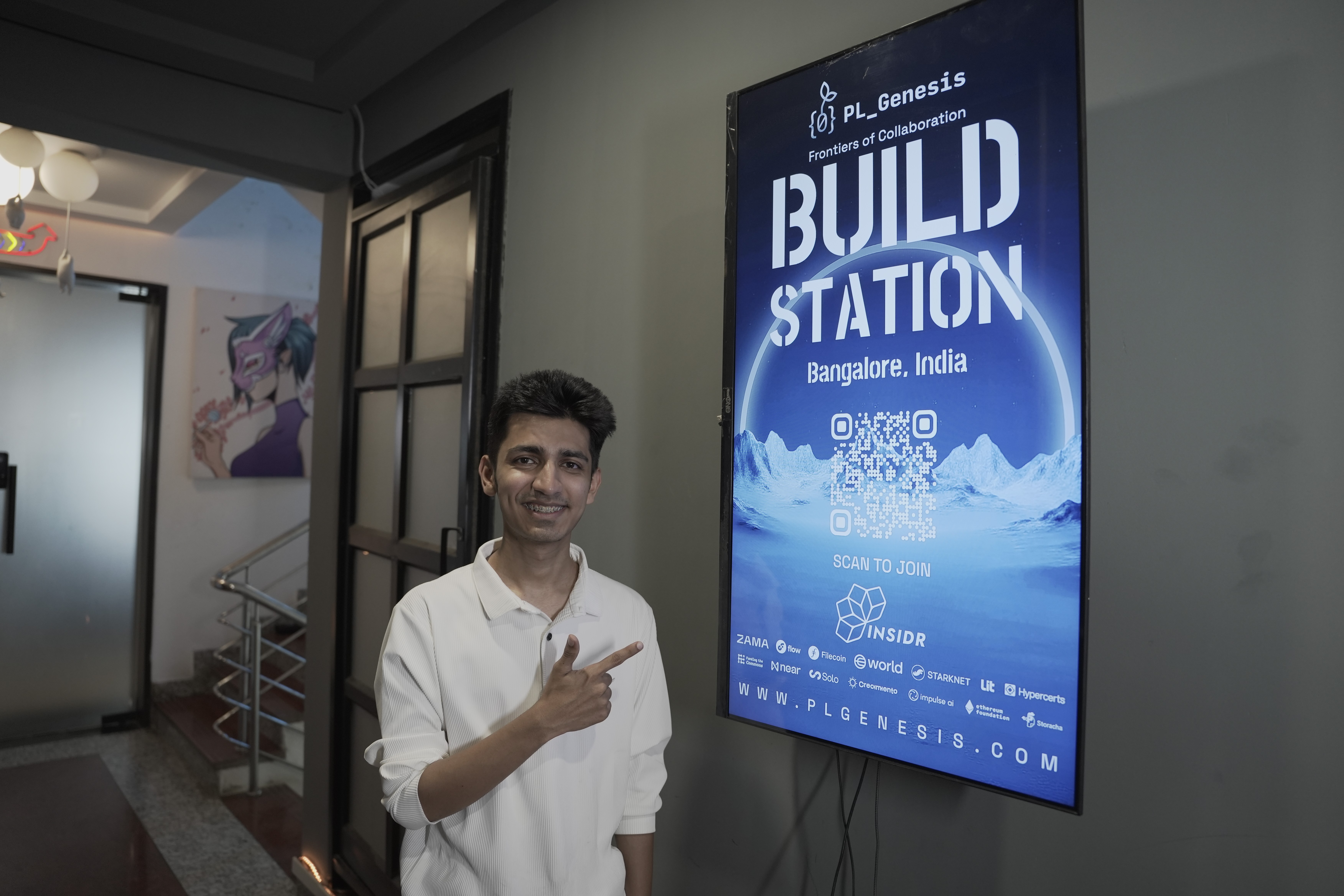 PL Genesis Build Station Bengaluru event signage and attendee check-in moment
