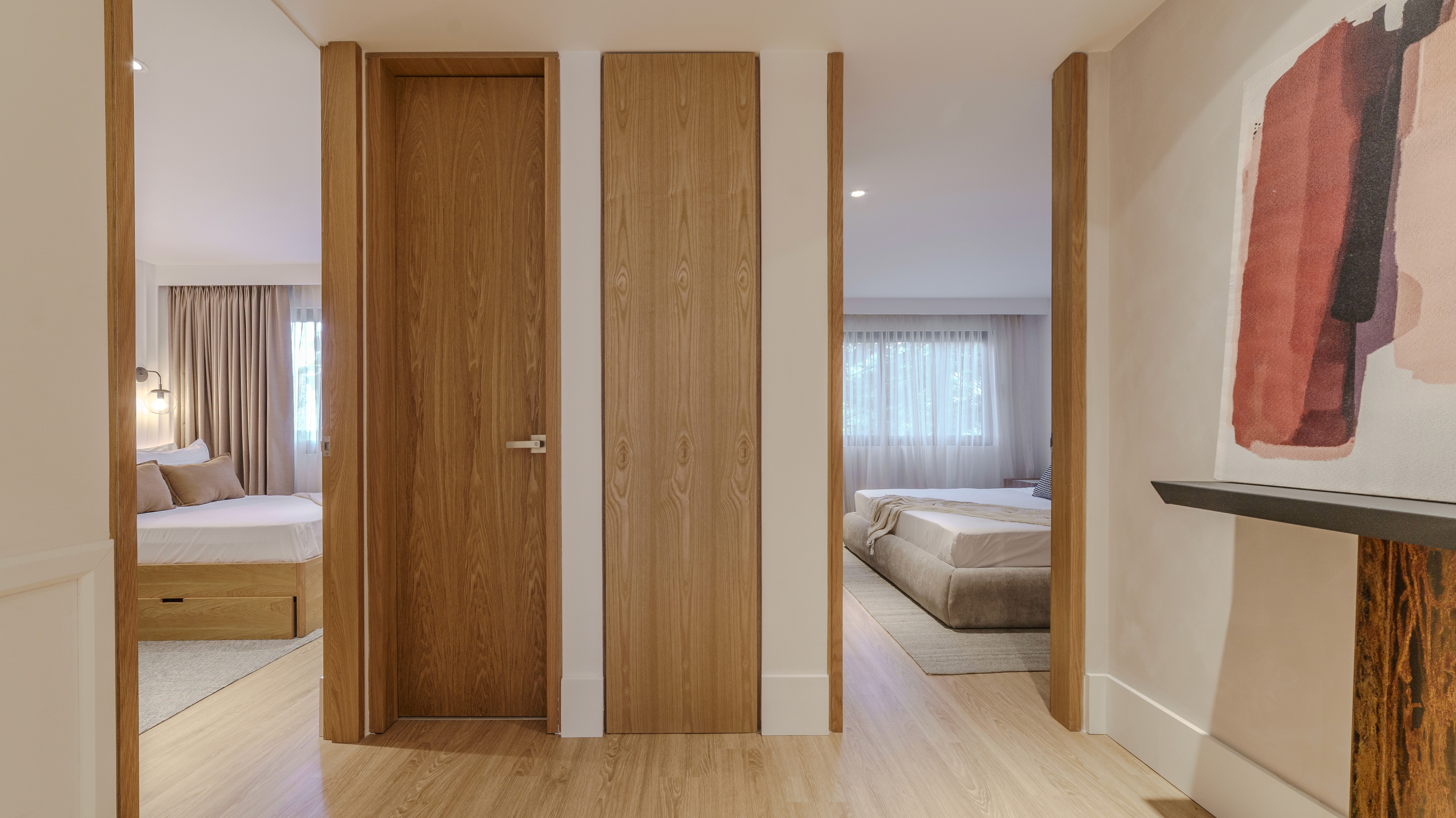 Double-height interior with flowing sculptural forms and warm raking light