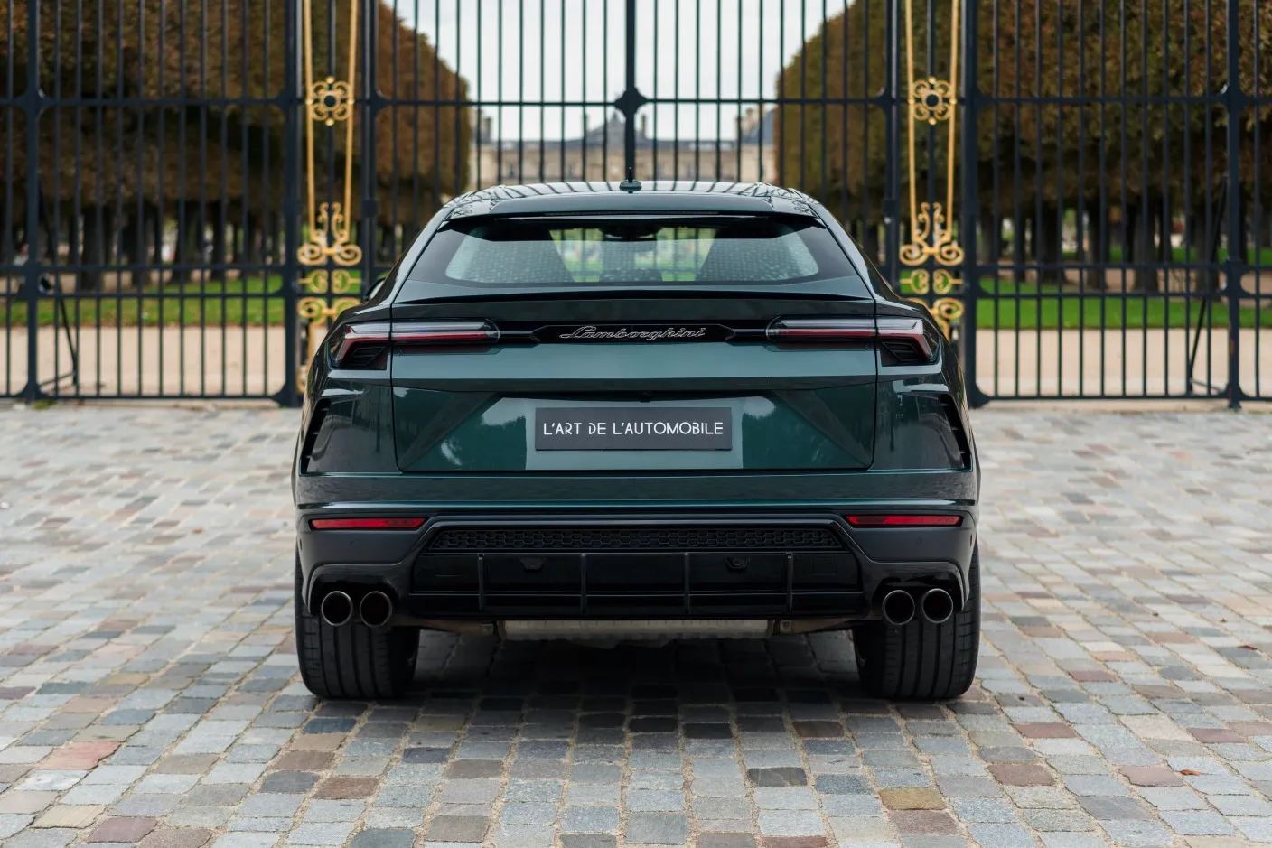 Green SUV at palace gates
