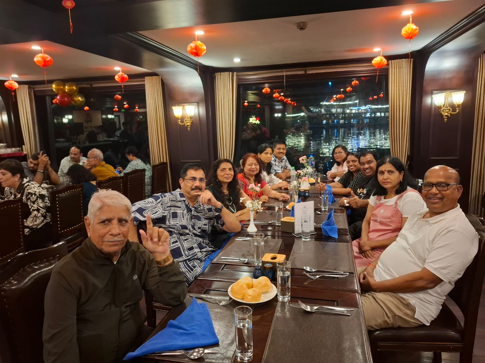 woman in white and red dress standing on green grass field during daytime