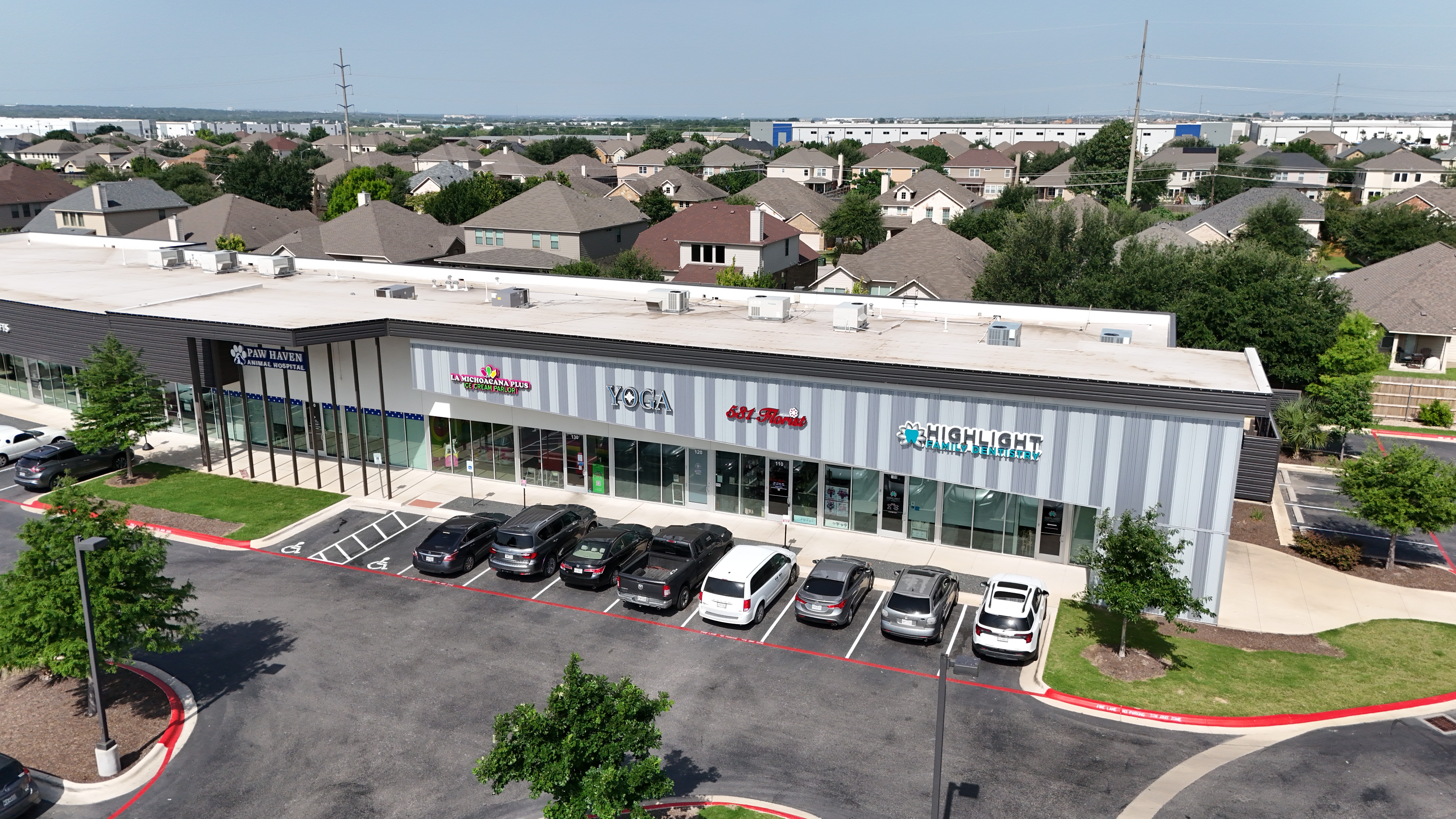 White commercial building roof by america roof solutions