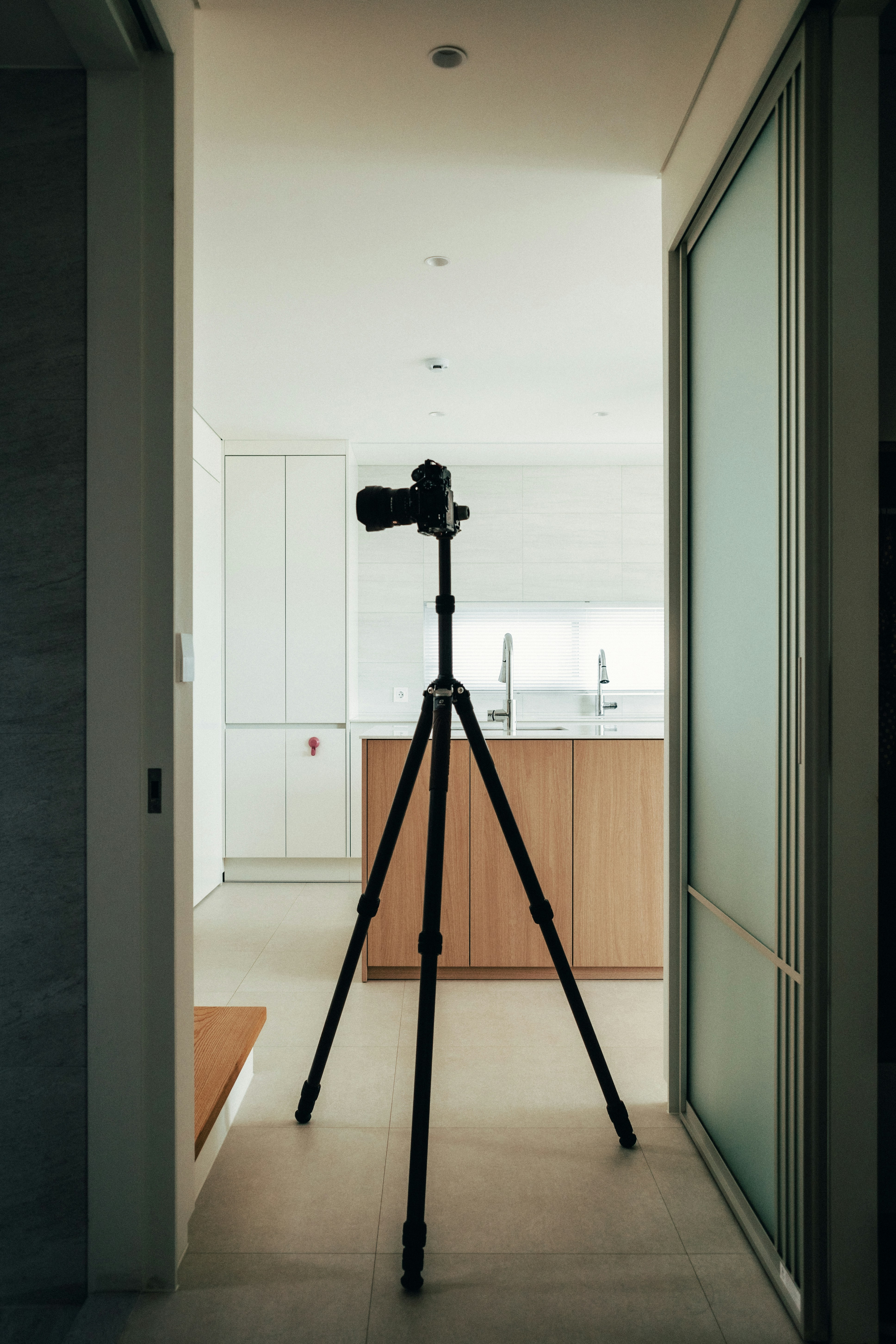 A camera on a tripod in a hallway