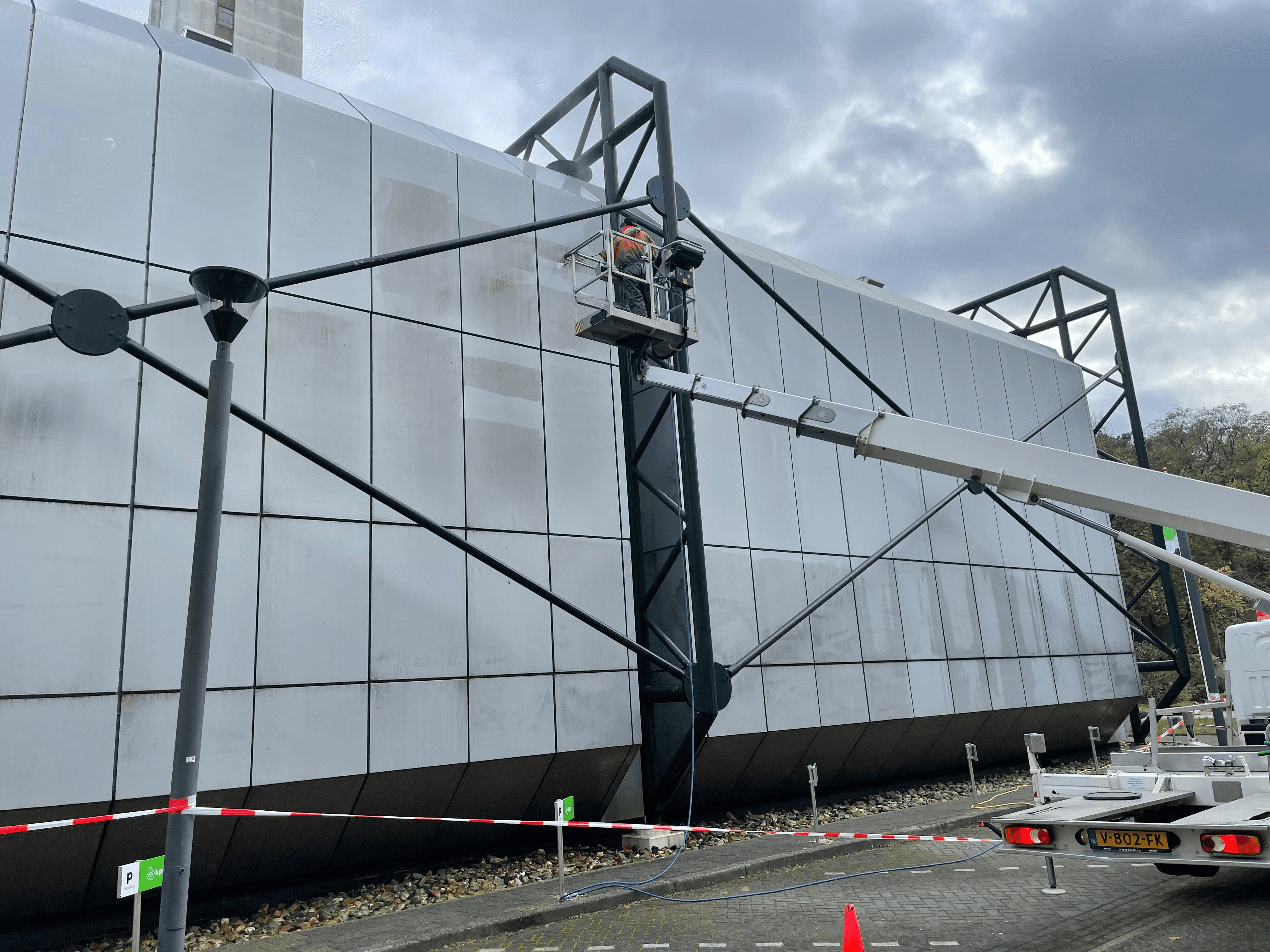 man in black crew neck t-shirt and blue shorts holding woman in white and red
