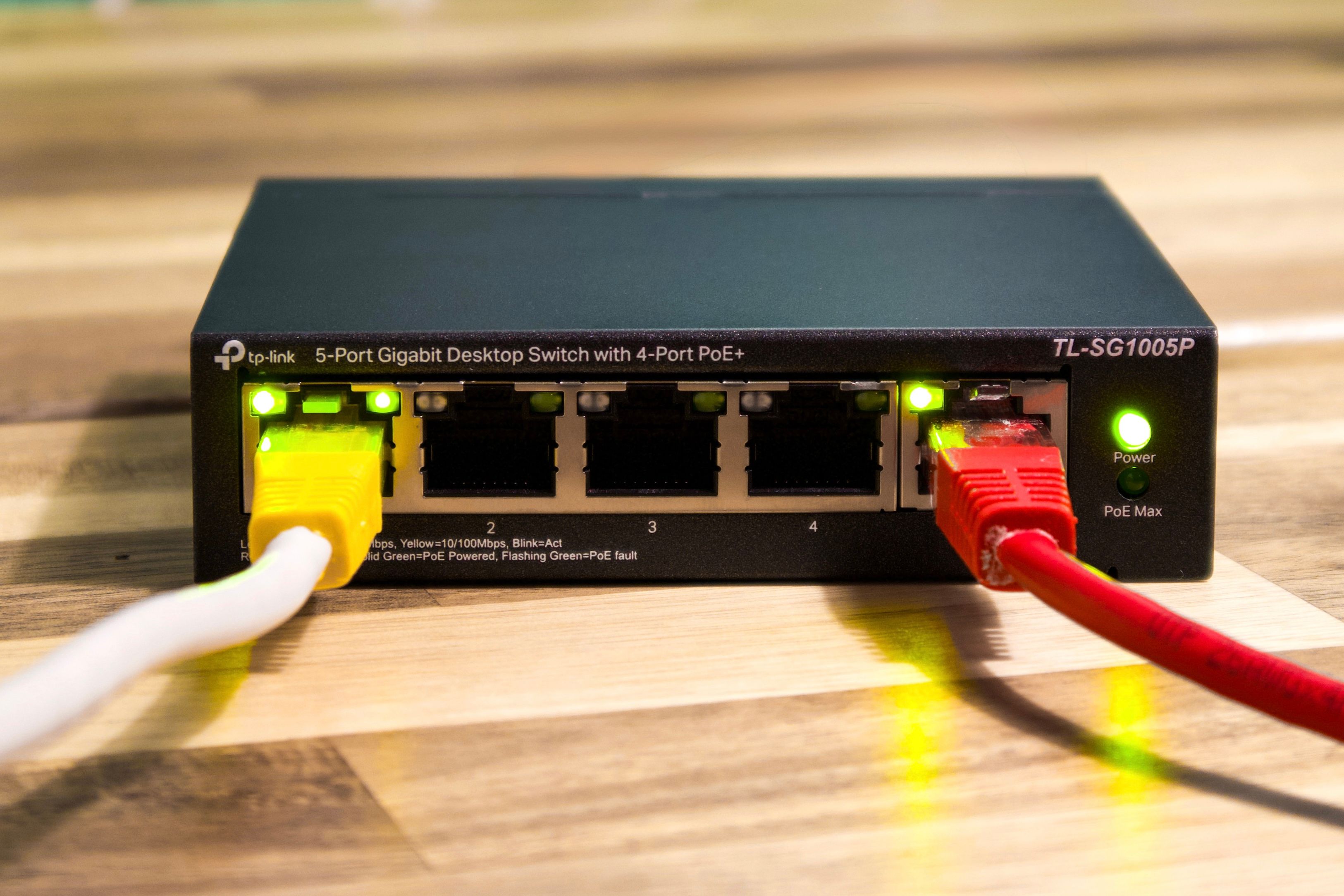close-up-of-a-tp-link-ethernet-switch-with-yellow,-red,-and-white-cables-connect - pascal-📷 (pexels)