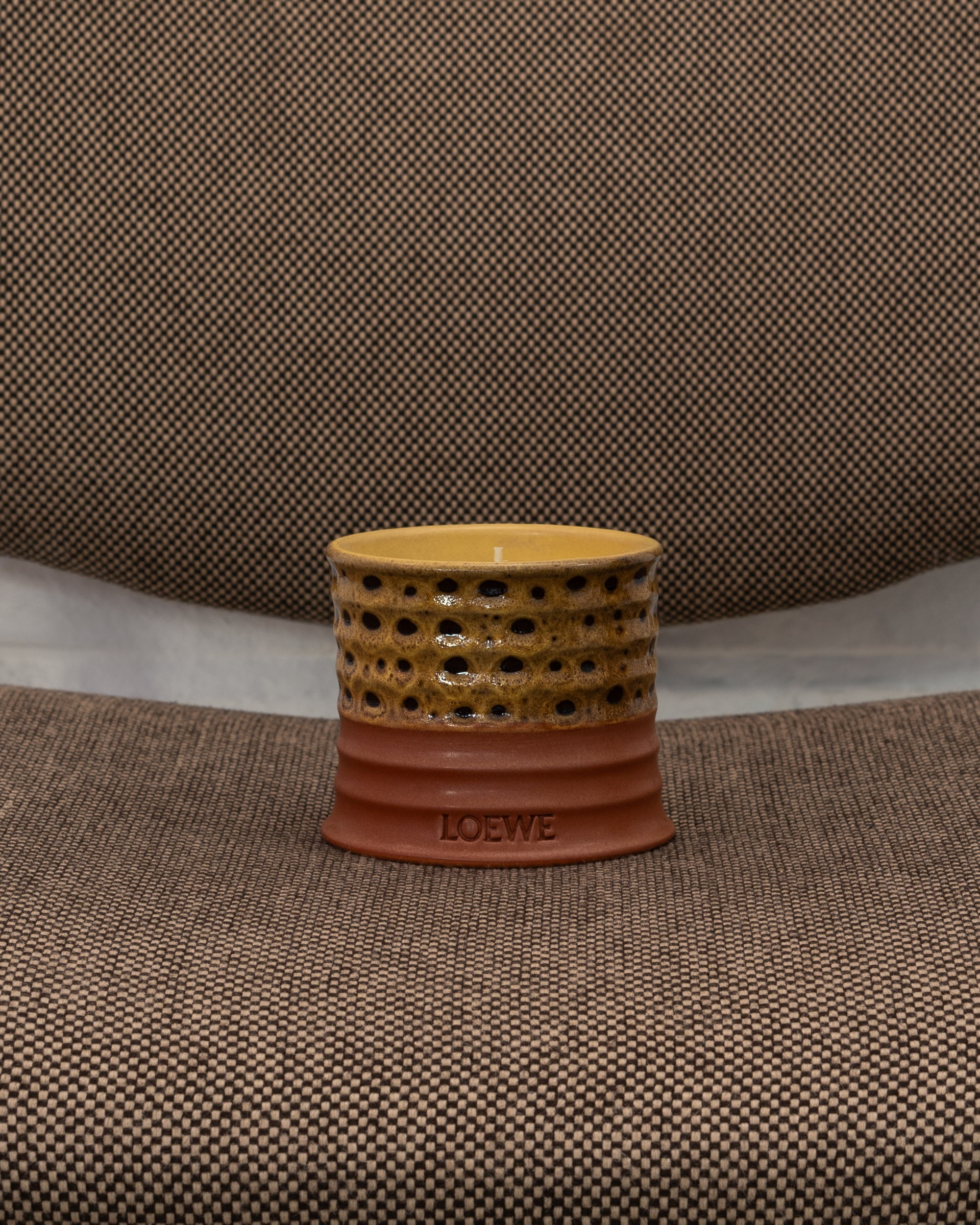 LOEWE perfume candle photographed on a chair at Los Círculos de Oíza
