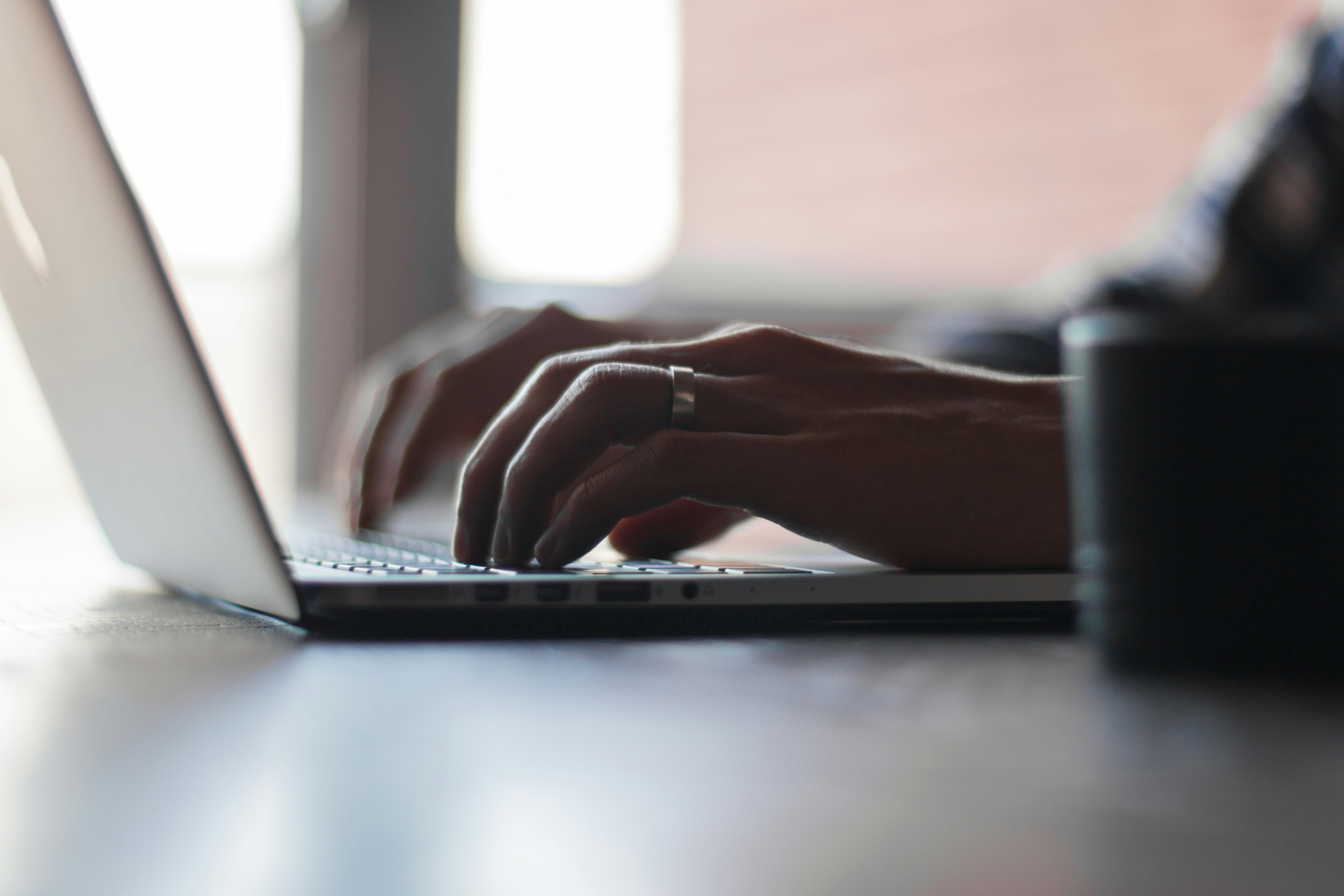 Person Working on Laptop- Hyperwrite Alternative