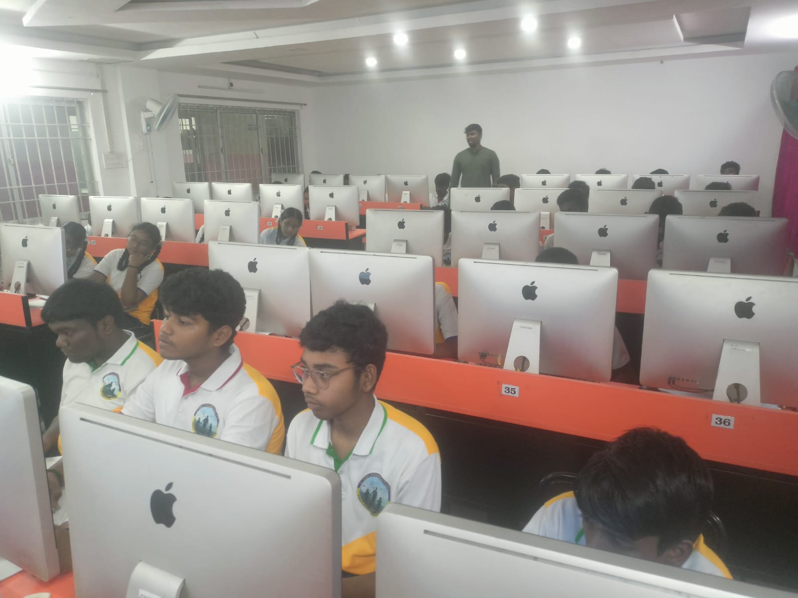 A man stading with Surfboard