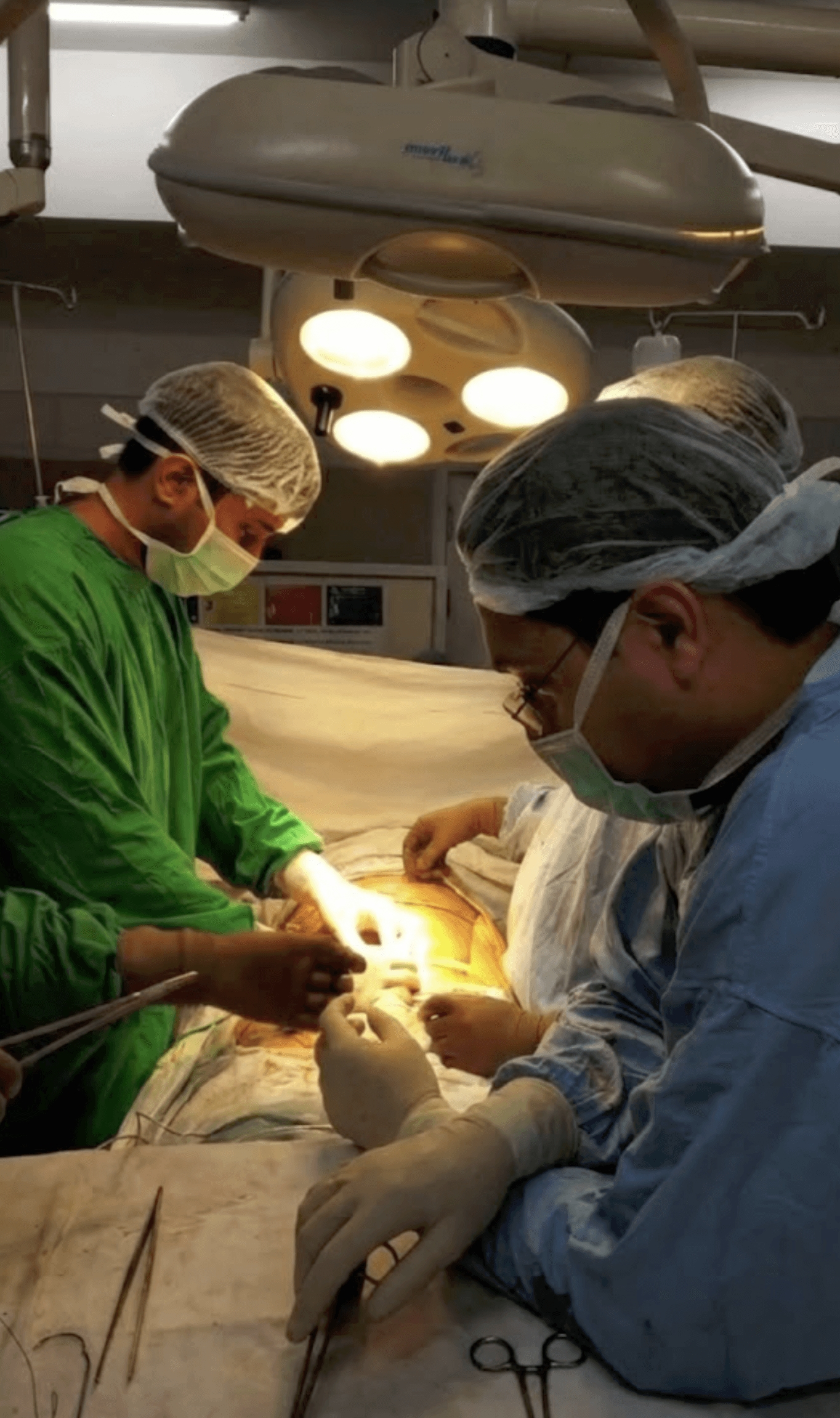 Dr Tushar and his team stitching with robot.