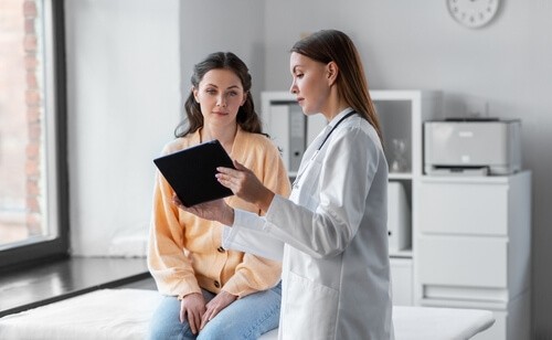 Woman doctor with woman patient