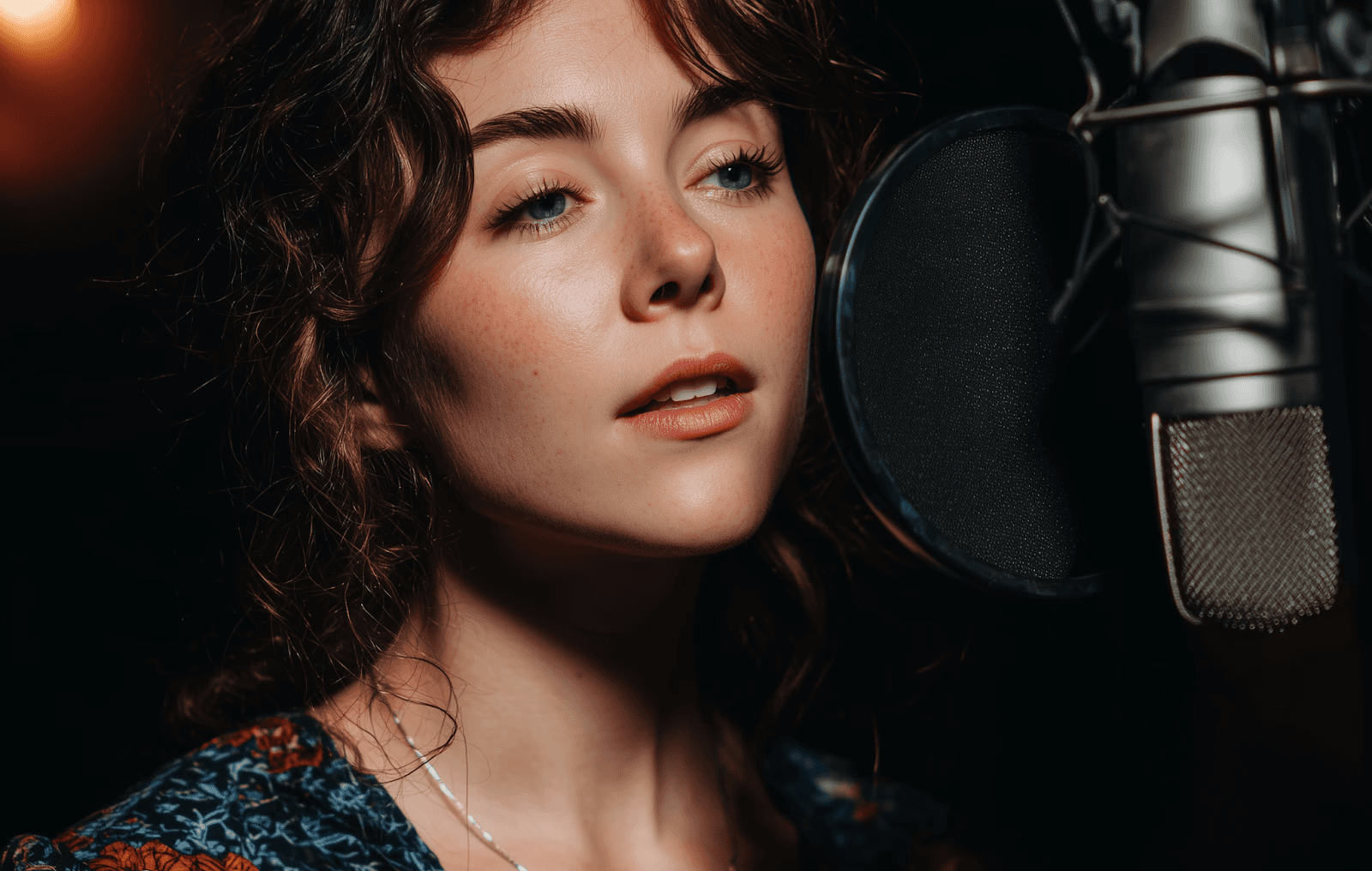 Color photo of female singer in the studio