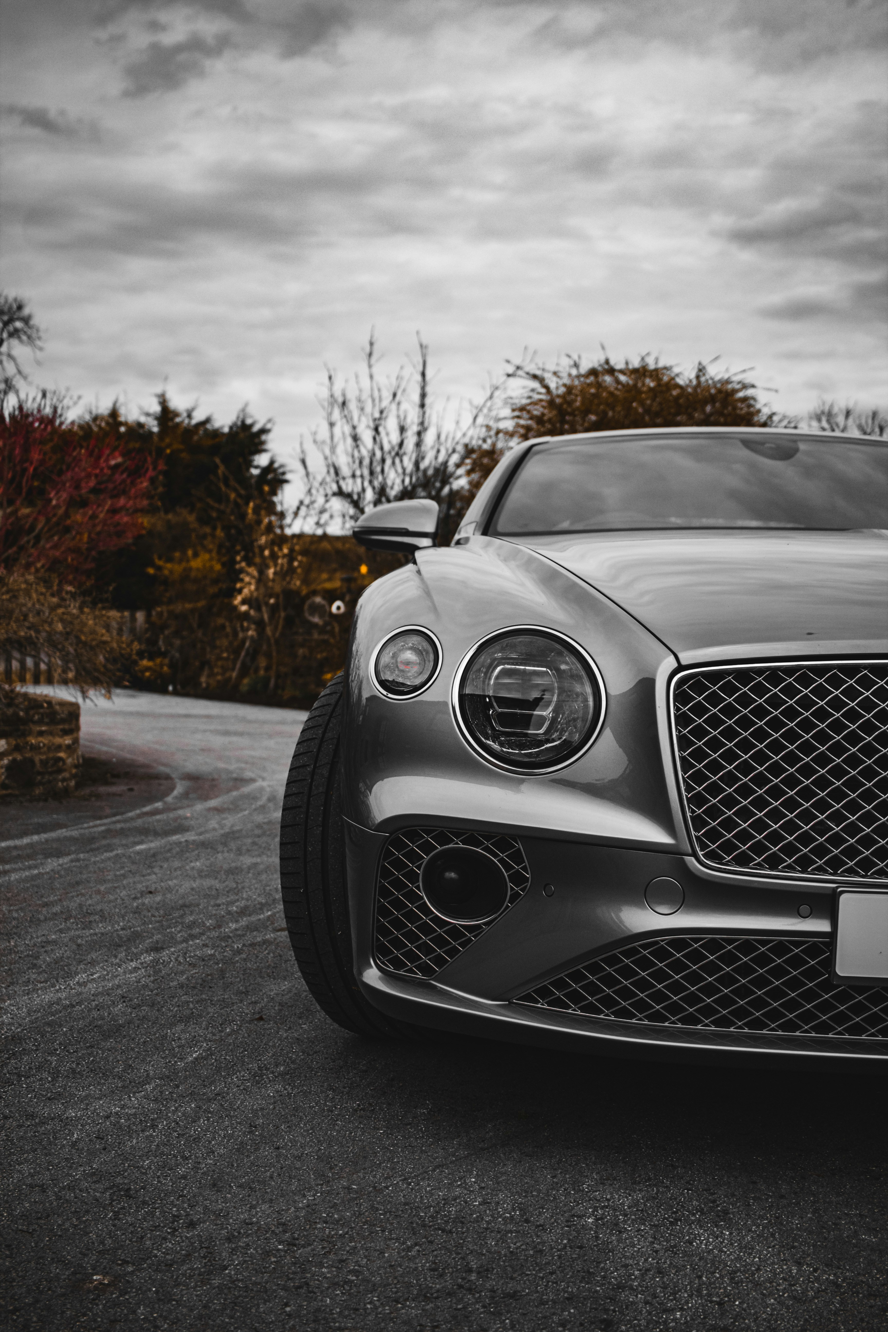 a silver car parked on the side of a road