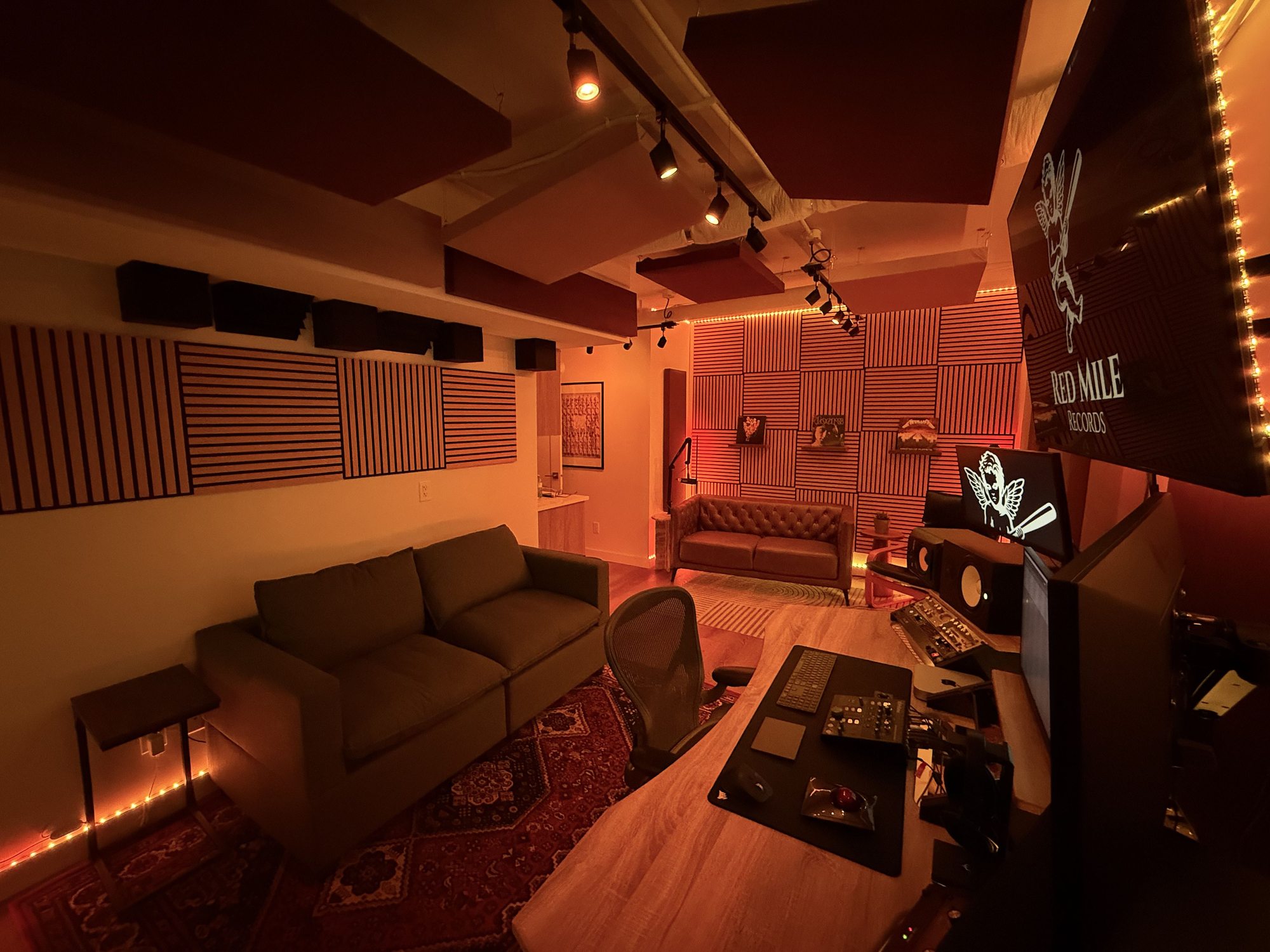 Comfortable podcast recording space for interviews and content creation at Red Mile Records studio in Calgary.