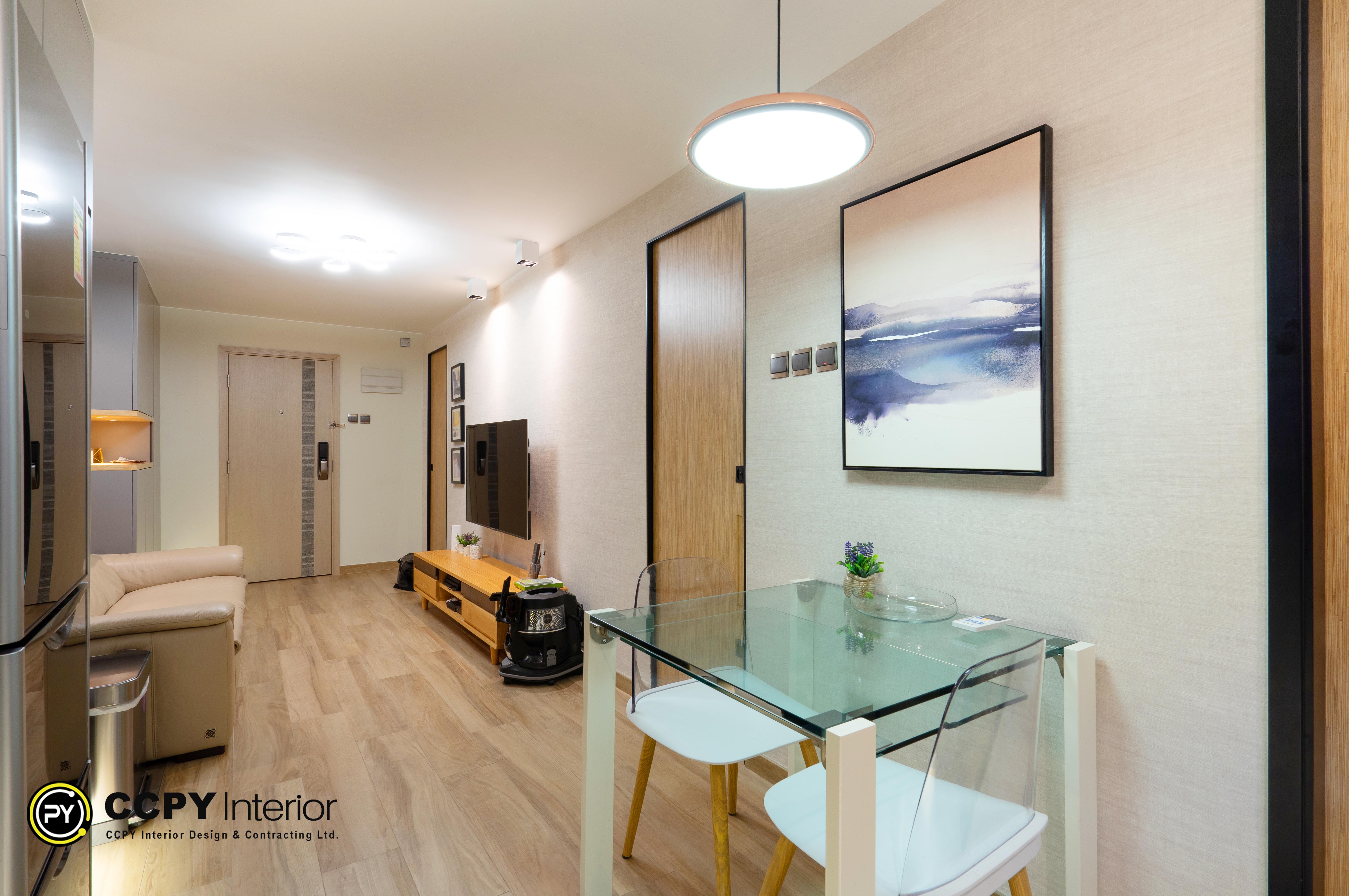he selected region displays an interior design showcase by CCPY Interior Design & Contracting Ltd. for a residential flat in Hong Kong.Unit OverviewLocation: Pok Hong Estate, ShatinSize: 455 Square FeetStyle: Warm contemporary aestheticKey Design FeaturesSmart Space Planning: Open-plan layout integrating the dining and living spaces seamlessly.Warm Contemporary Aesthetic: Combining light wood flooring, warm beige walls, and soft lighting fixtures.Functional Zoning: Clear structural separation of areas using a glass dining table and a well-placed accent wall painting.Custom Storage: Utilizes space-saving, custom-built solutions tailored for Hong Kong's compact living environments.