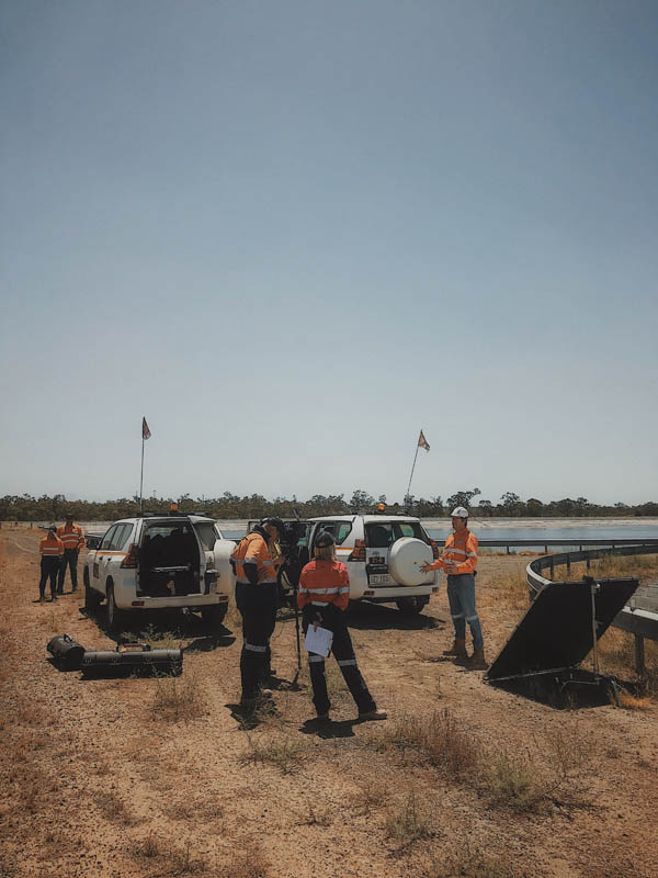 Wide aerial view of Numax Media crew and vehicles on remote outback location