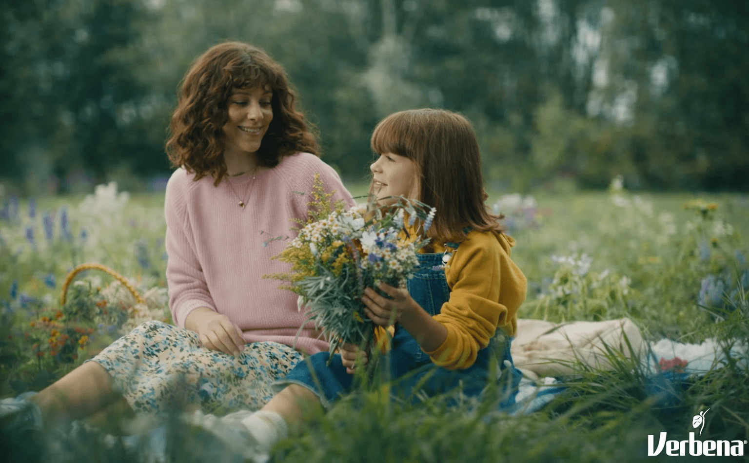 Stack of modern books and magazine with minimalist cover design on leather chair