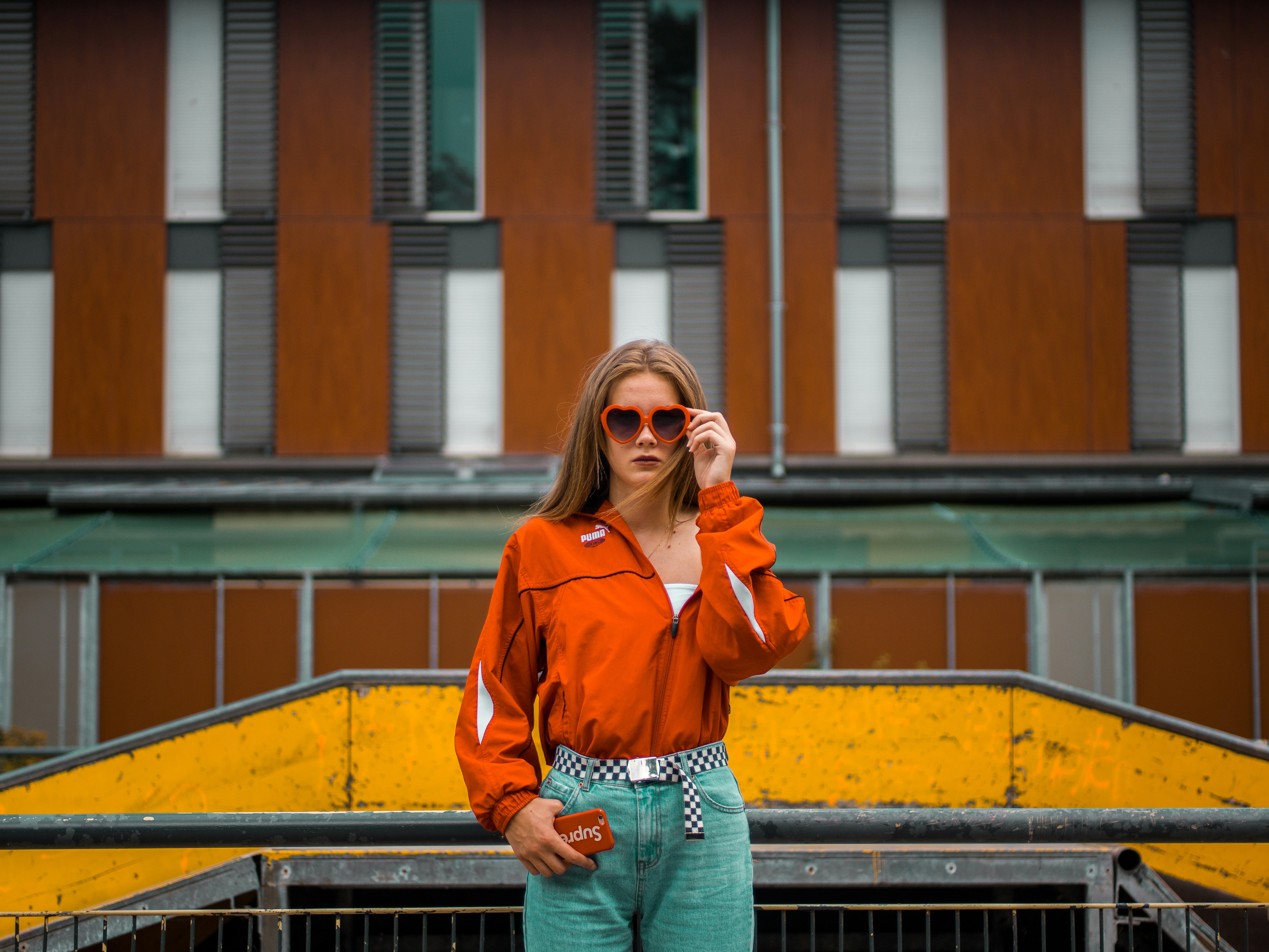 woman posing in orange jacket - Bright Spring Color Analysis