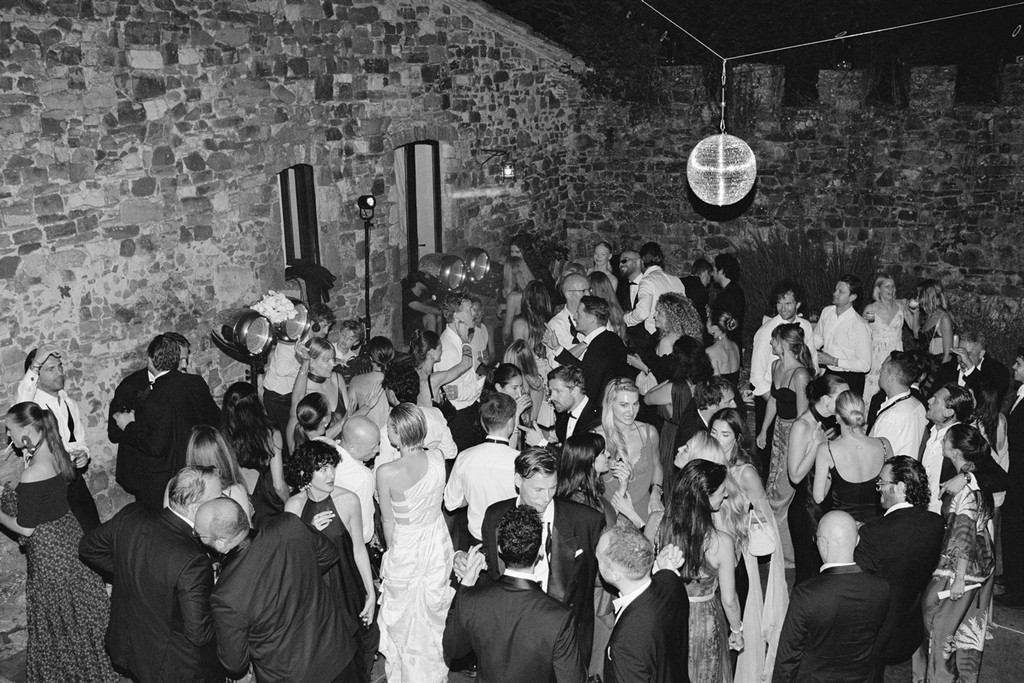 Black-and-white aerial view of guests dancing on the dancefloor at private estate