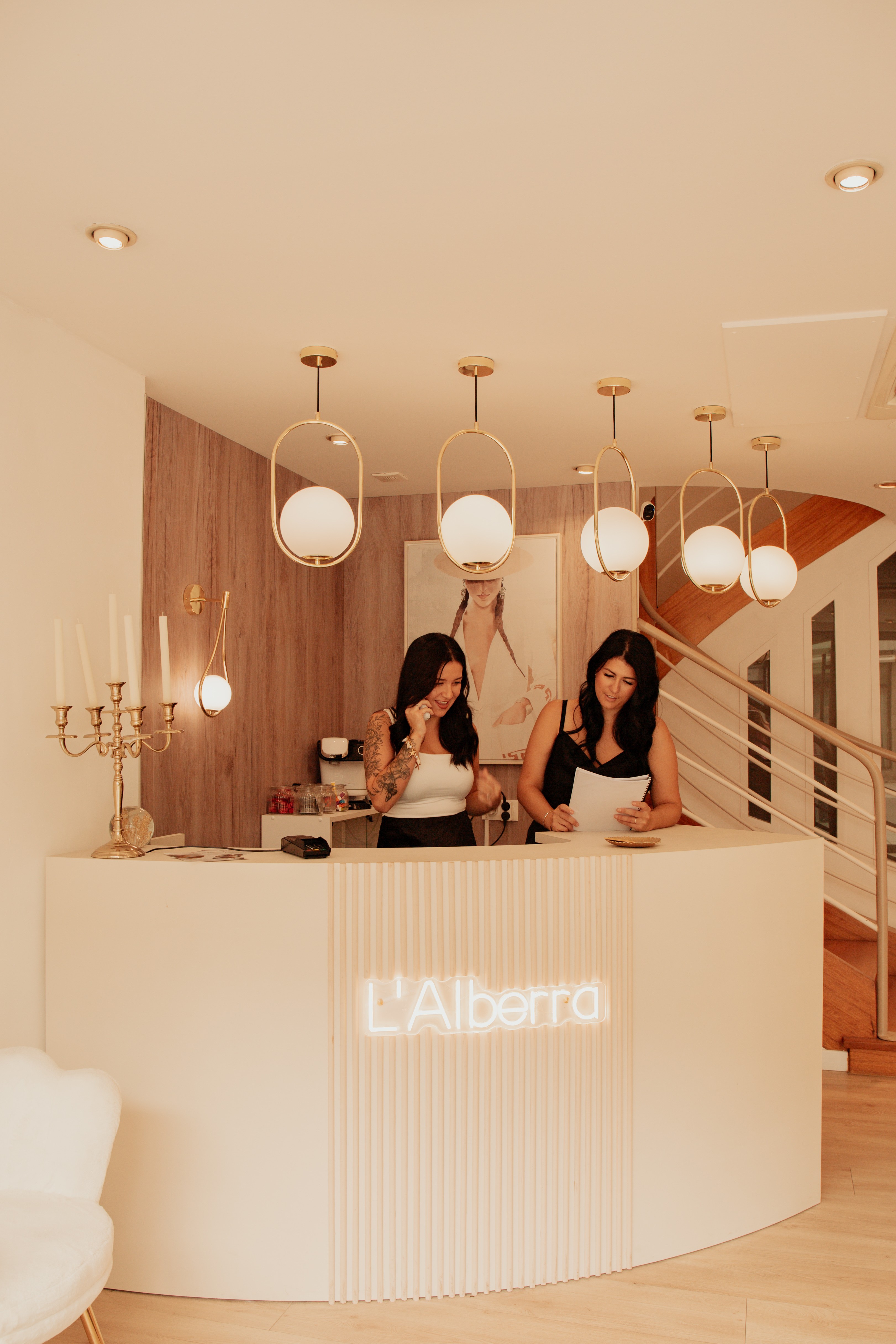 Minimalist floral branch with white flowers and yellow centers casting soft shadows