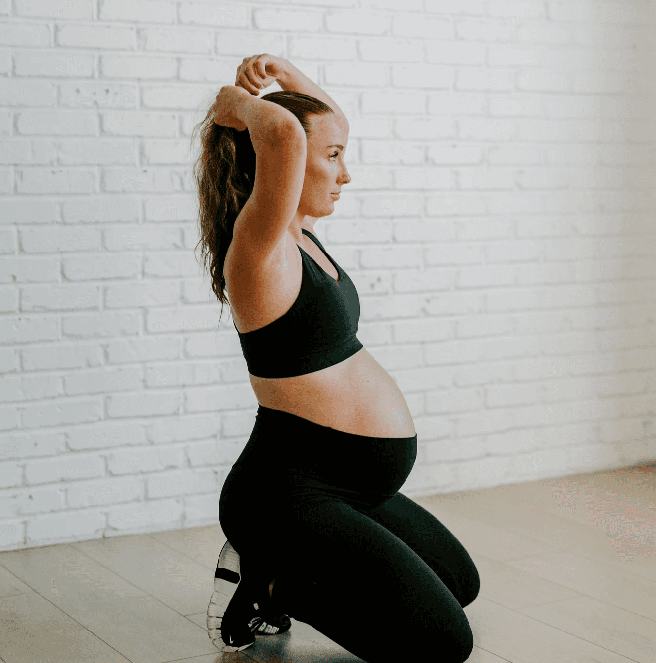 A person reviewing fitness activity on a mobile device inside a modern gym space, reflecting workout tracking, progress insights, and clear activity results.