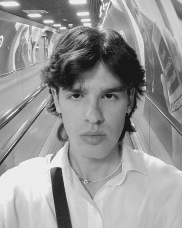 a blurry photo of a person standing in front of a wall