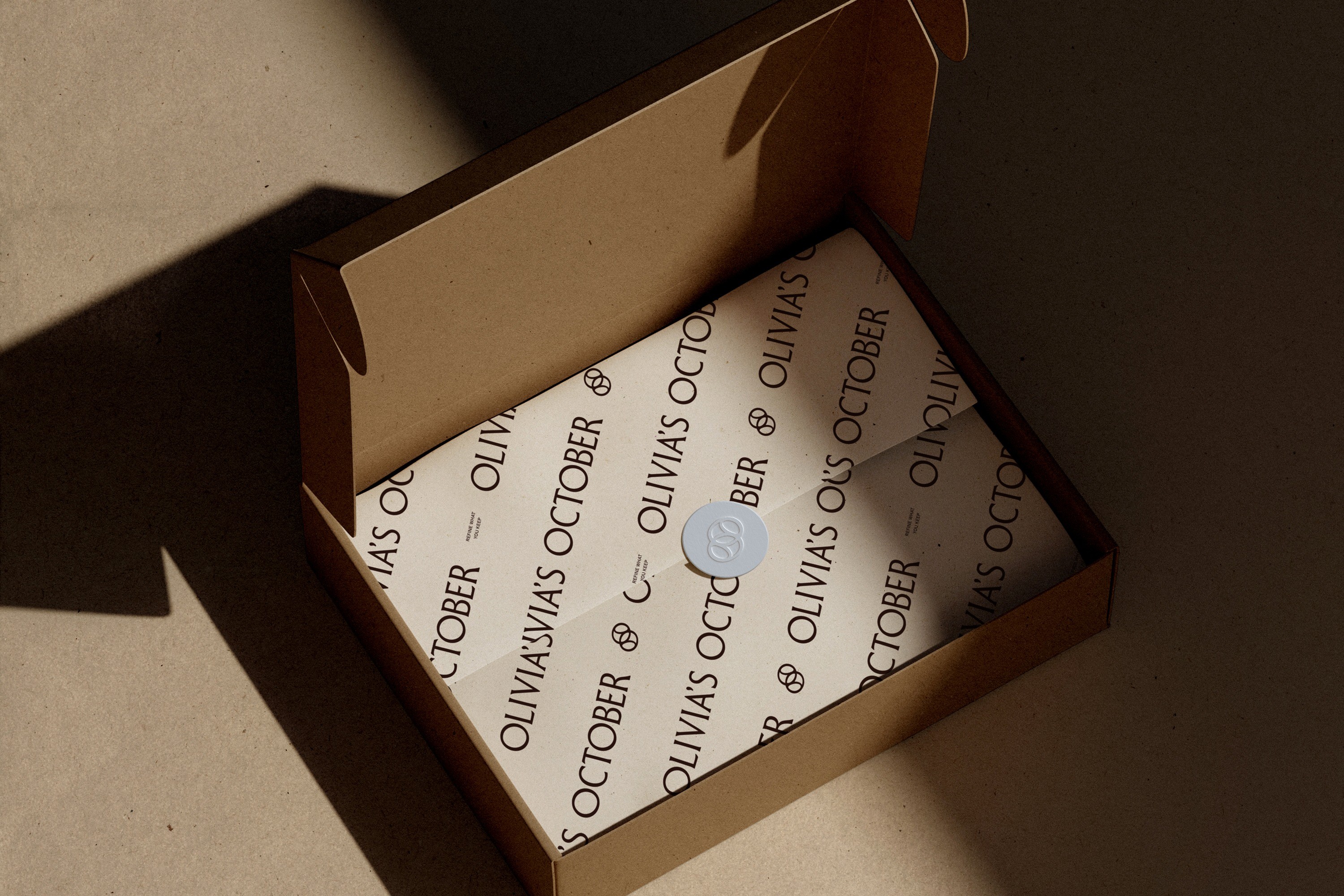 Olivia’s October fine jewelry packaging and brand identity
