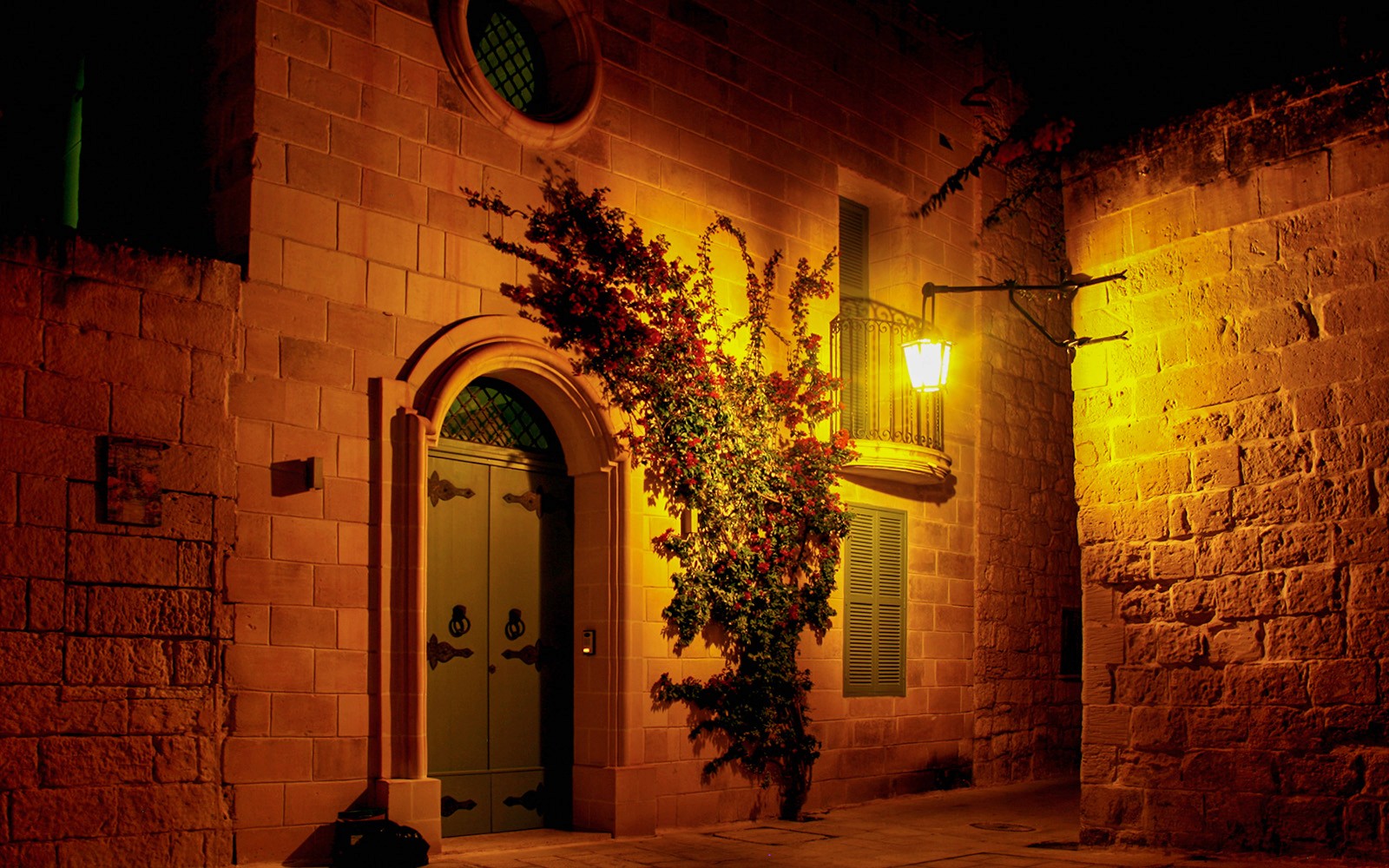 Historic Maltese building illuminated at night during a 3-hour guided tour.