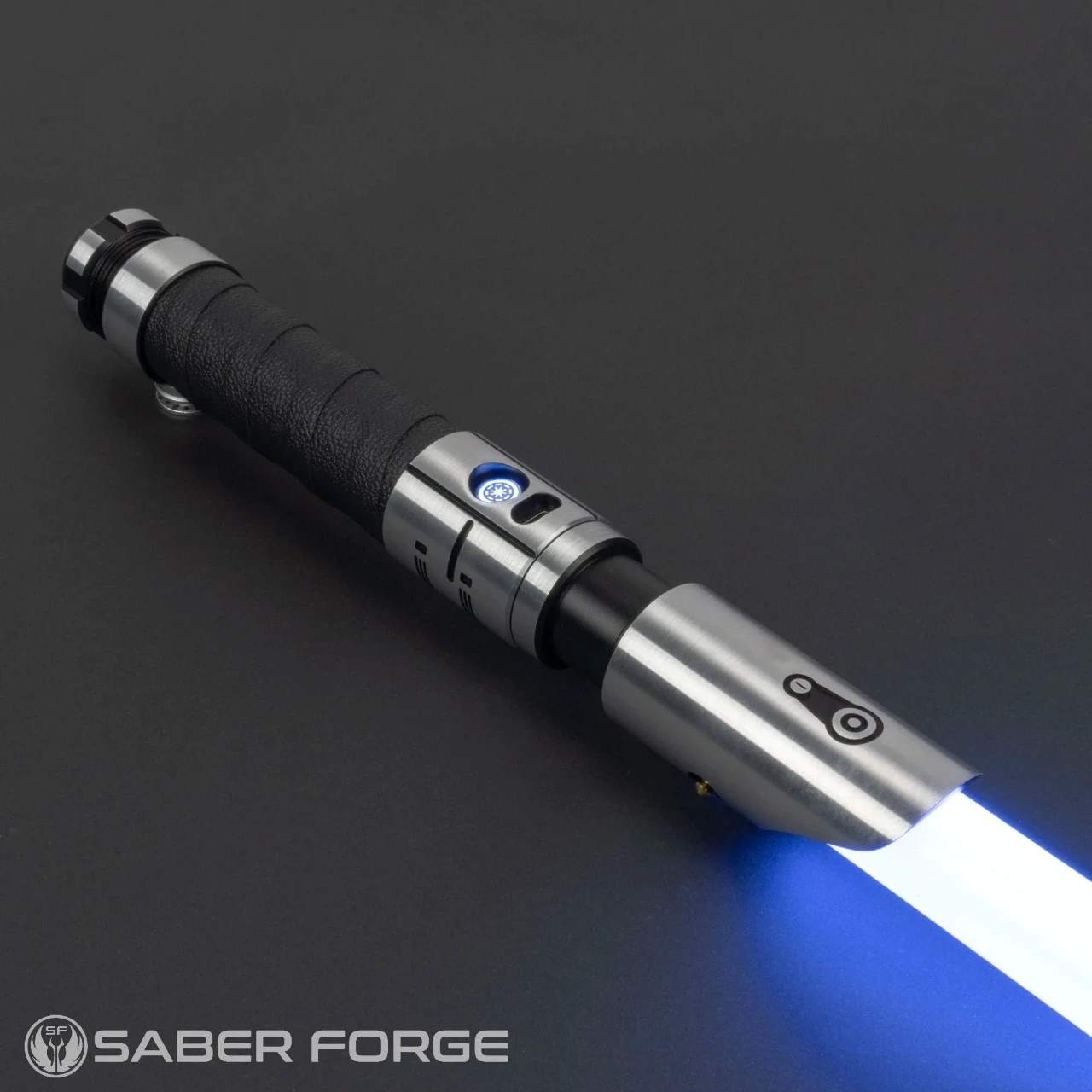 A sleek, metal hilted lightsaber displaying a vibrant blue blade against a plain background, showcasing the intricate craftsmanship and design by Saber Forge.