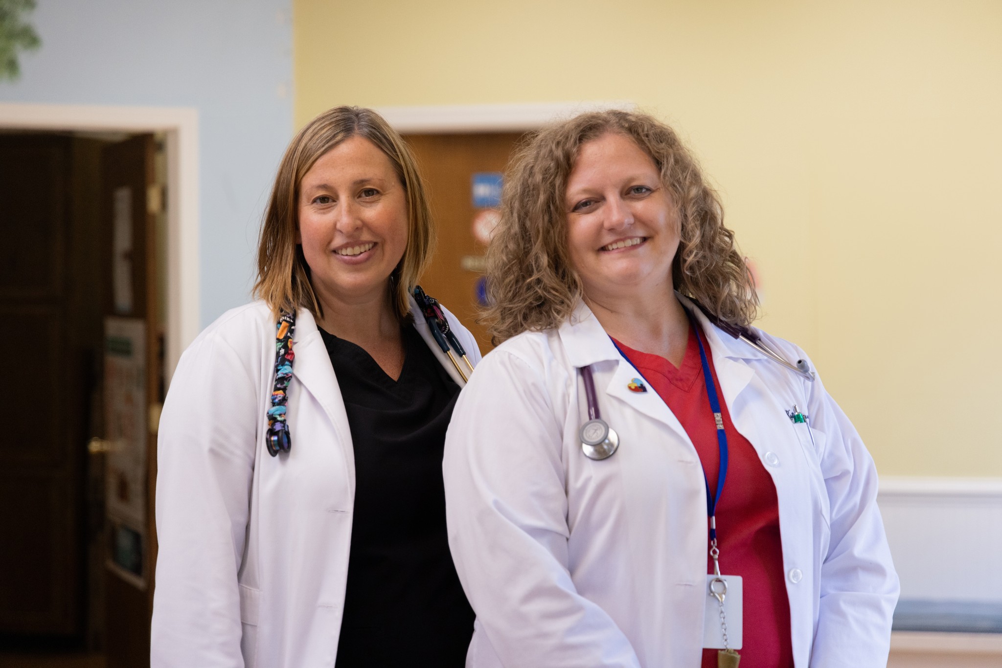 Two Pediatricians smiling.