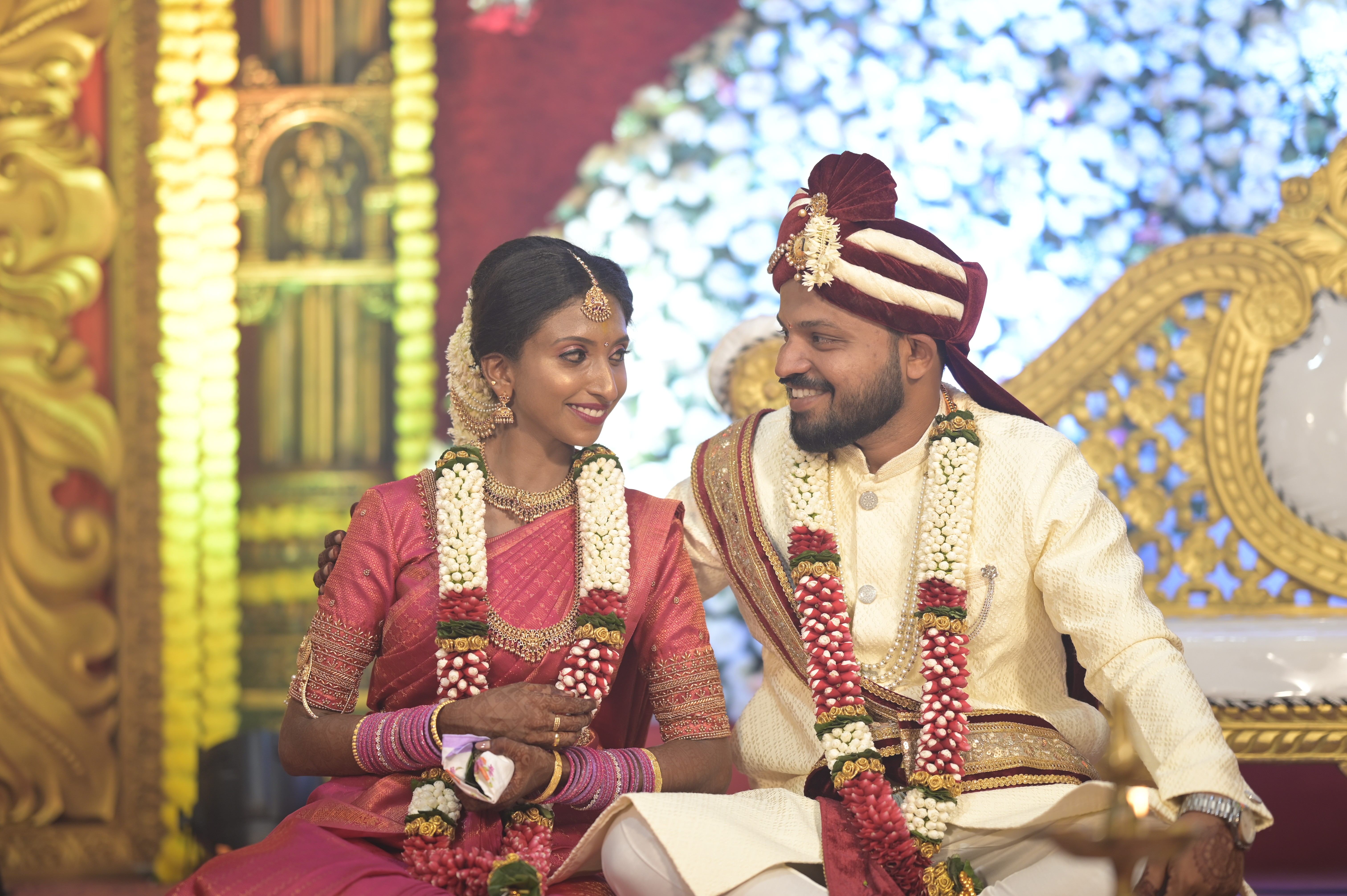Bride and groom looking at each other in South Indian wedding.