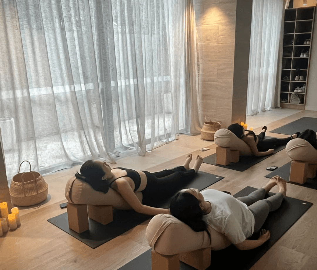 Spacious yoga studio with clean floors and calming ambiance.