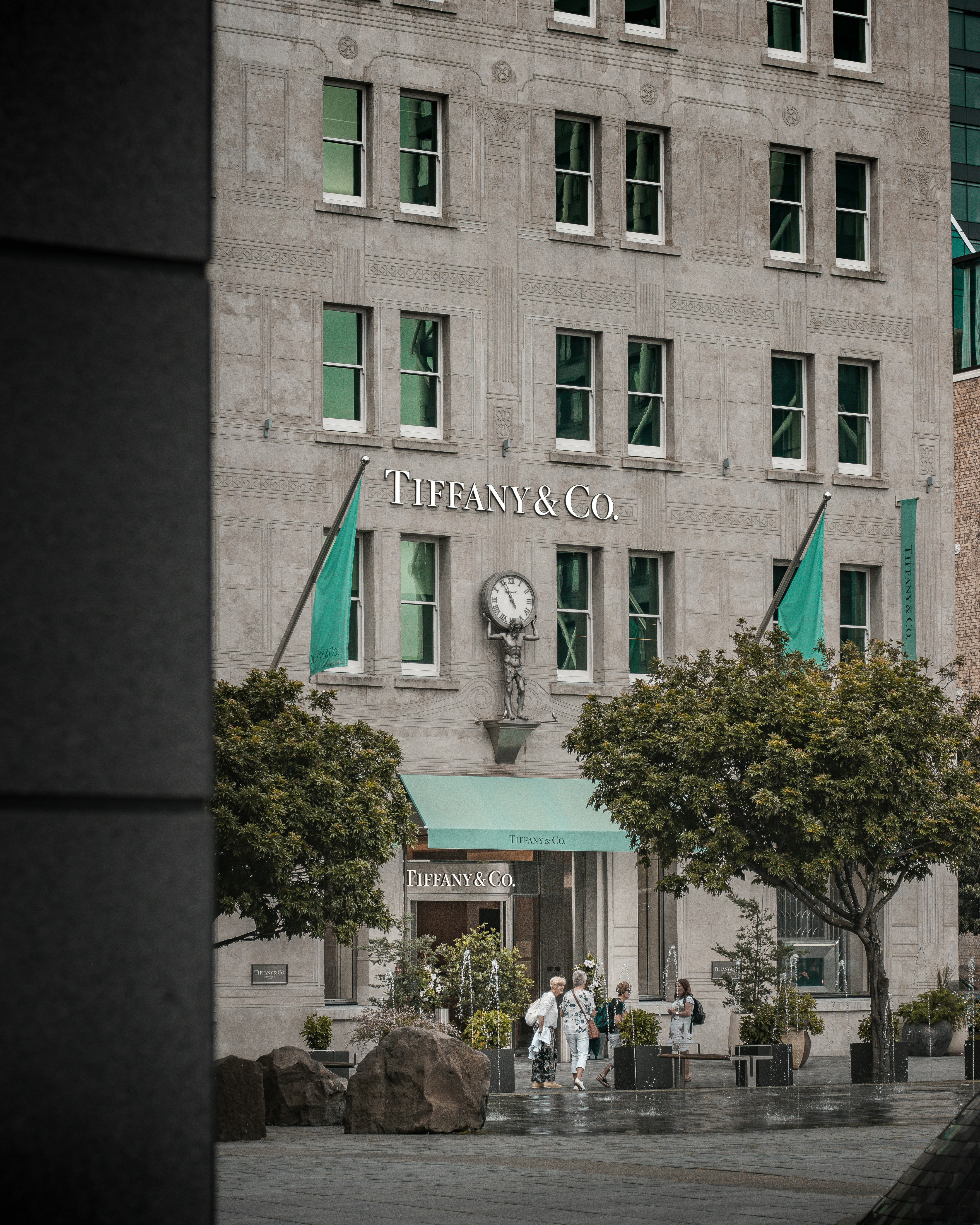 a-tall-building-with-a-clock-on-the-front-of-it - say-s. (unsplash)./pho