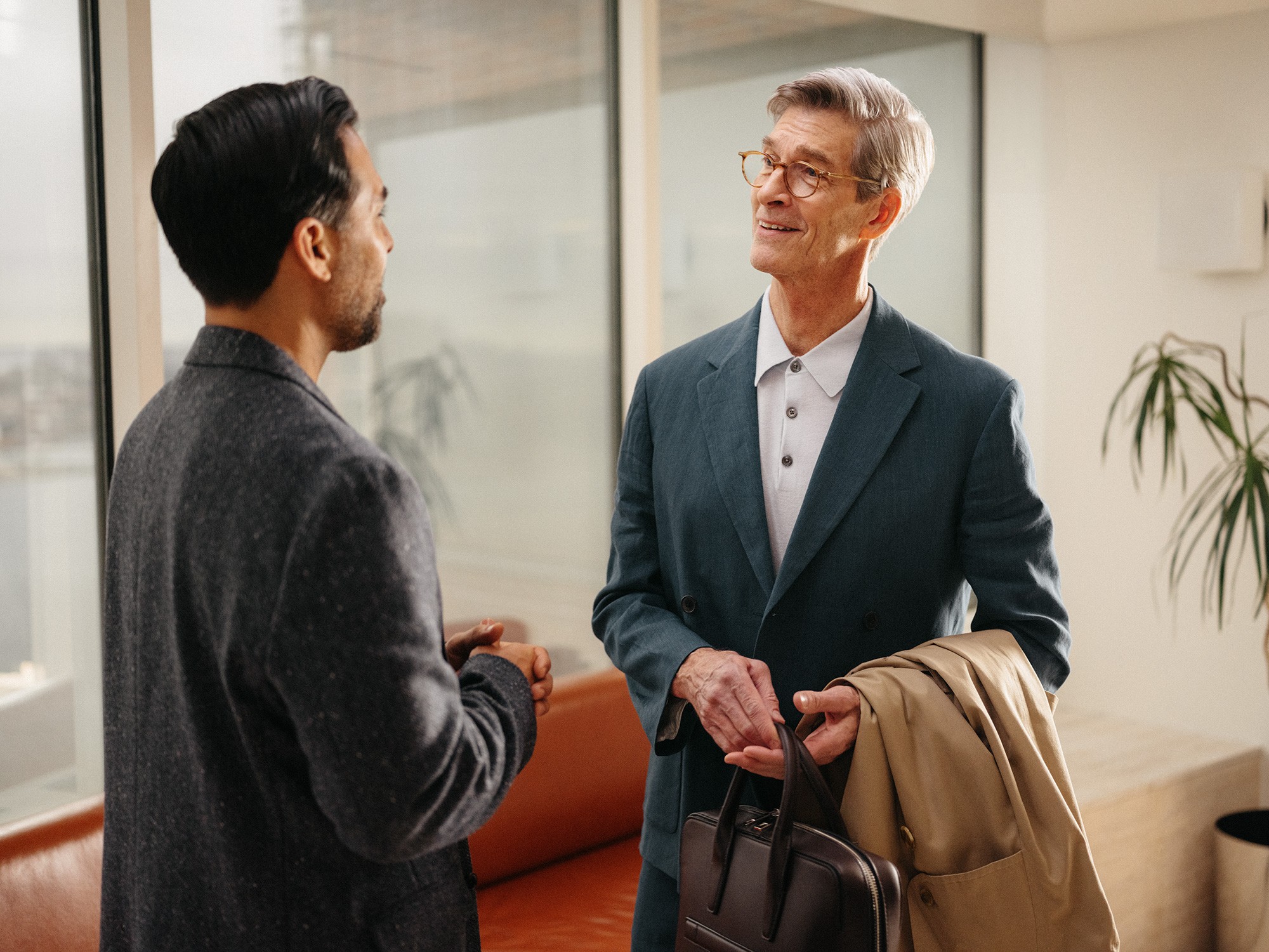 a man sitting in front of a laptop computer