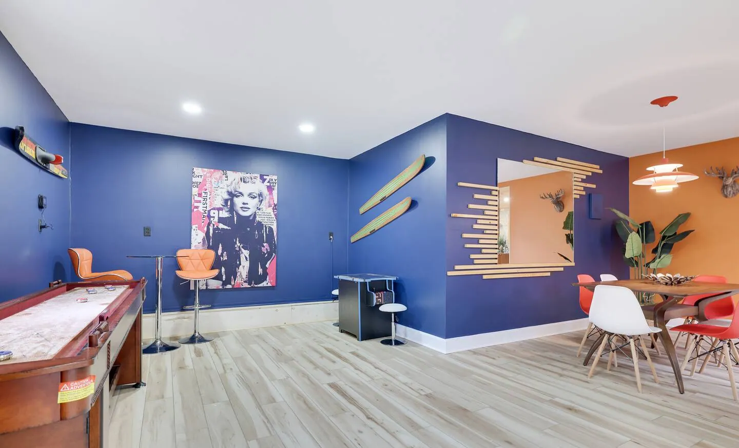Game room with shuffleboard, arcade table and high-top table at The Love Shack