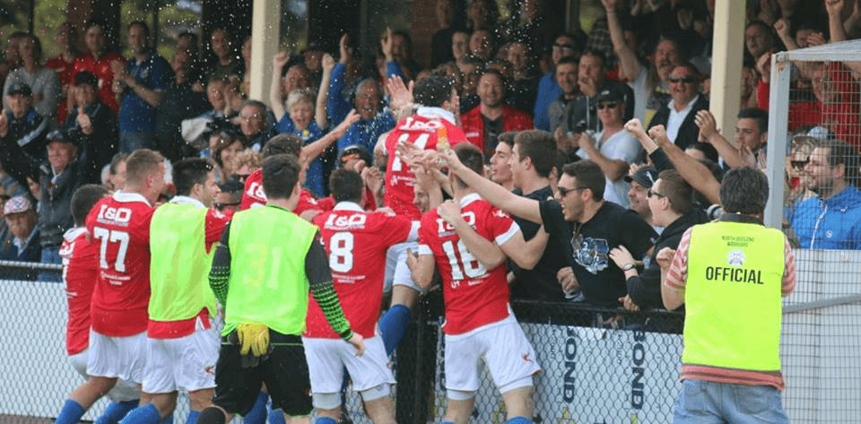 North Geelong players celebrating with the home fans at Elcho Park 