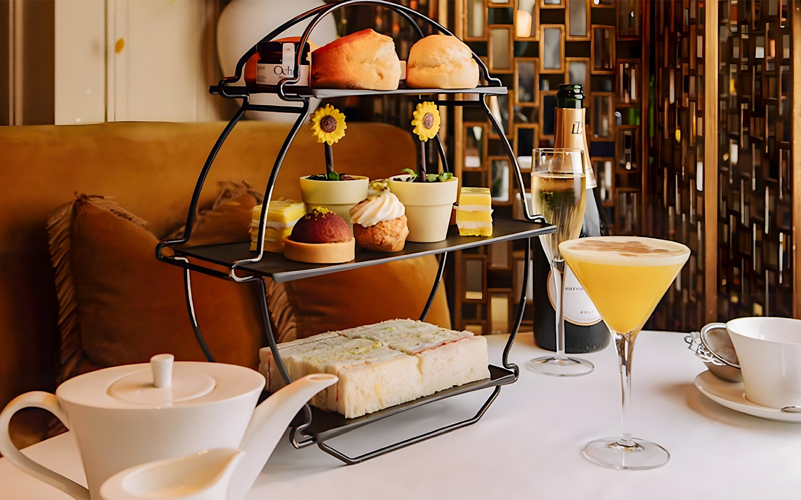 Afternoon tea set with pastries and sandwiches, part of National Gallery Guided Tour.