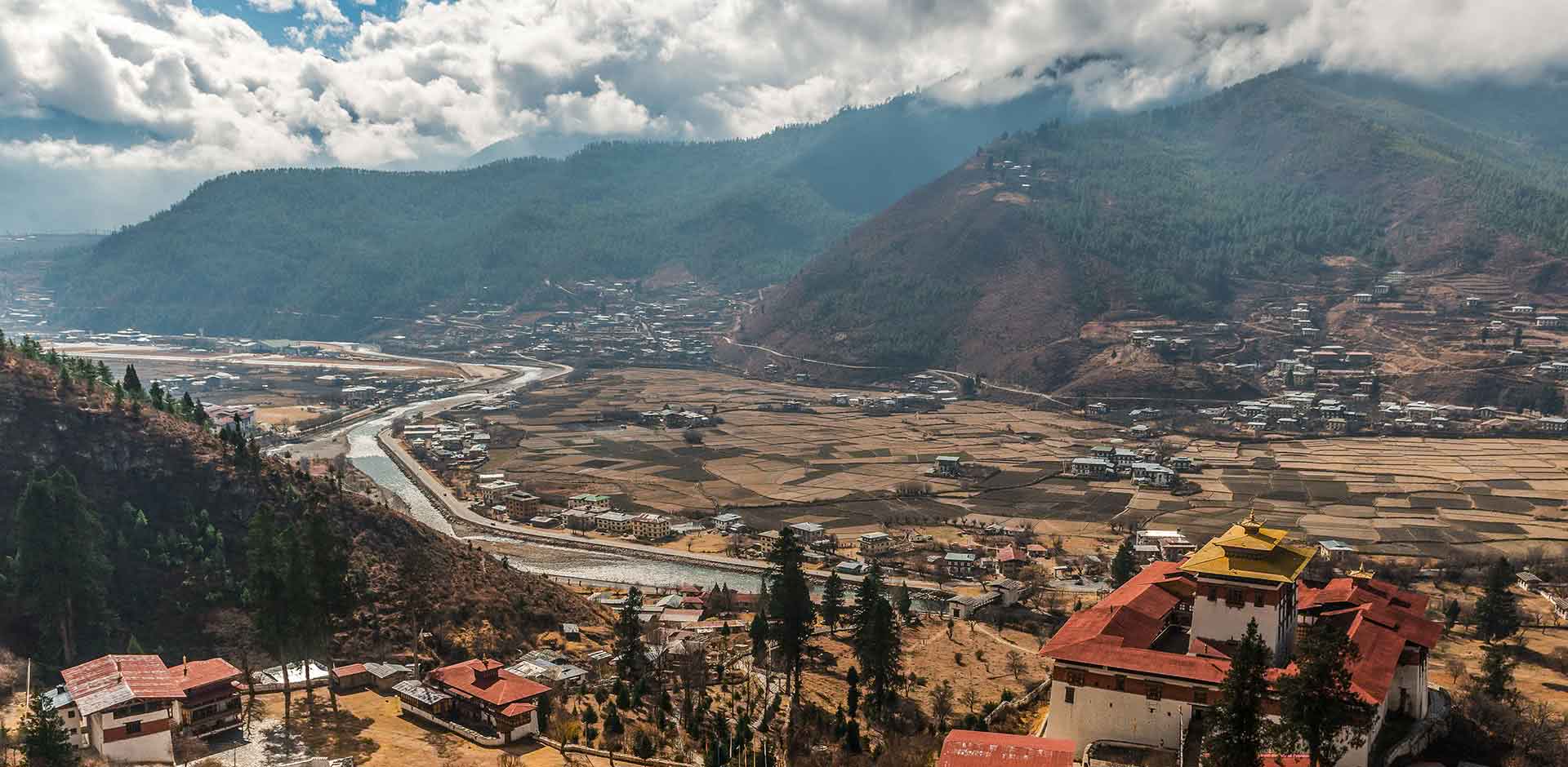 a building with flags flying in front of it
