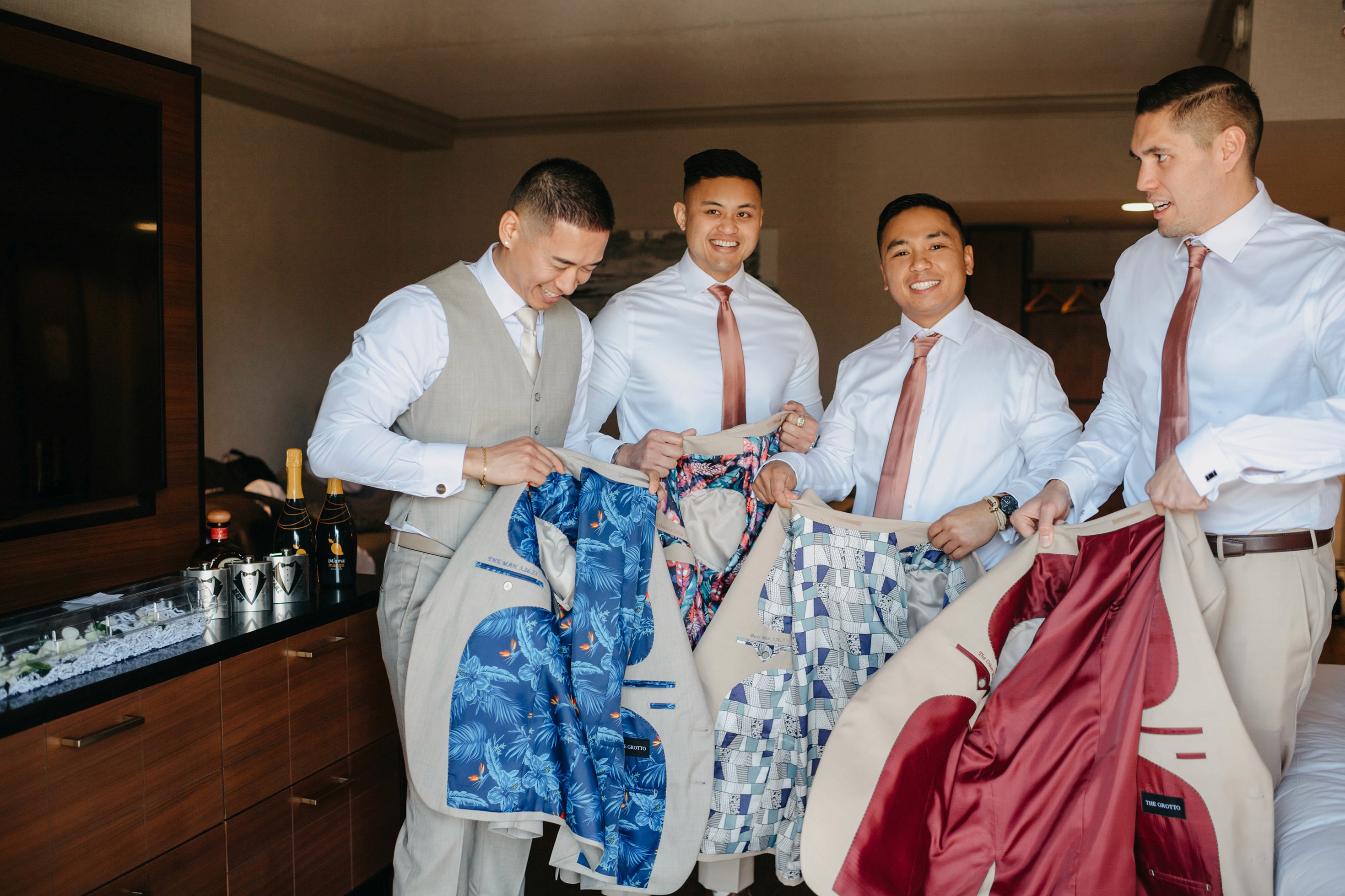 Groomsmen group portrait in matching neutral suits
