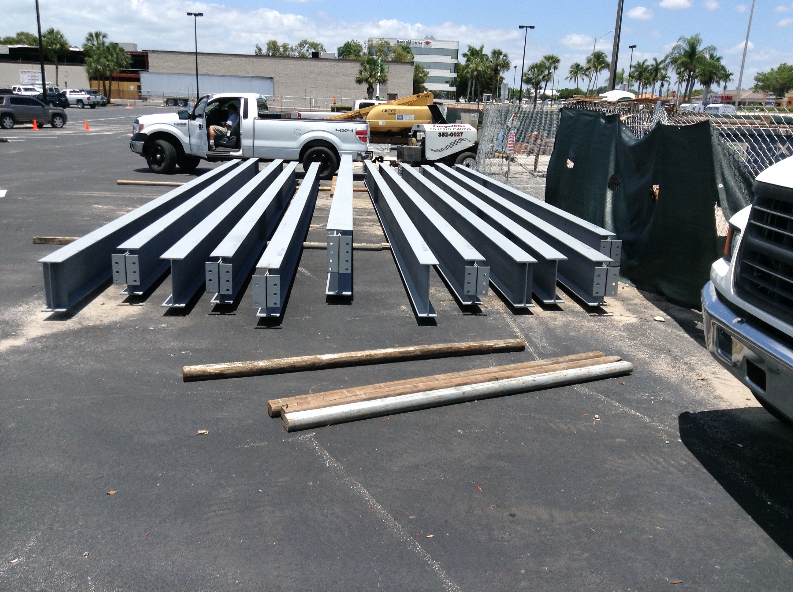 metal beams laying on pavement