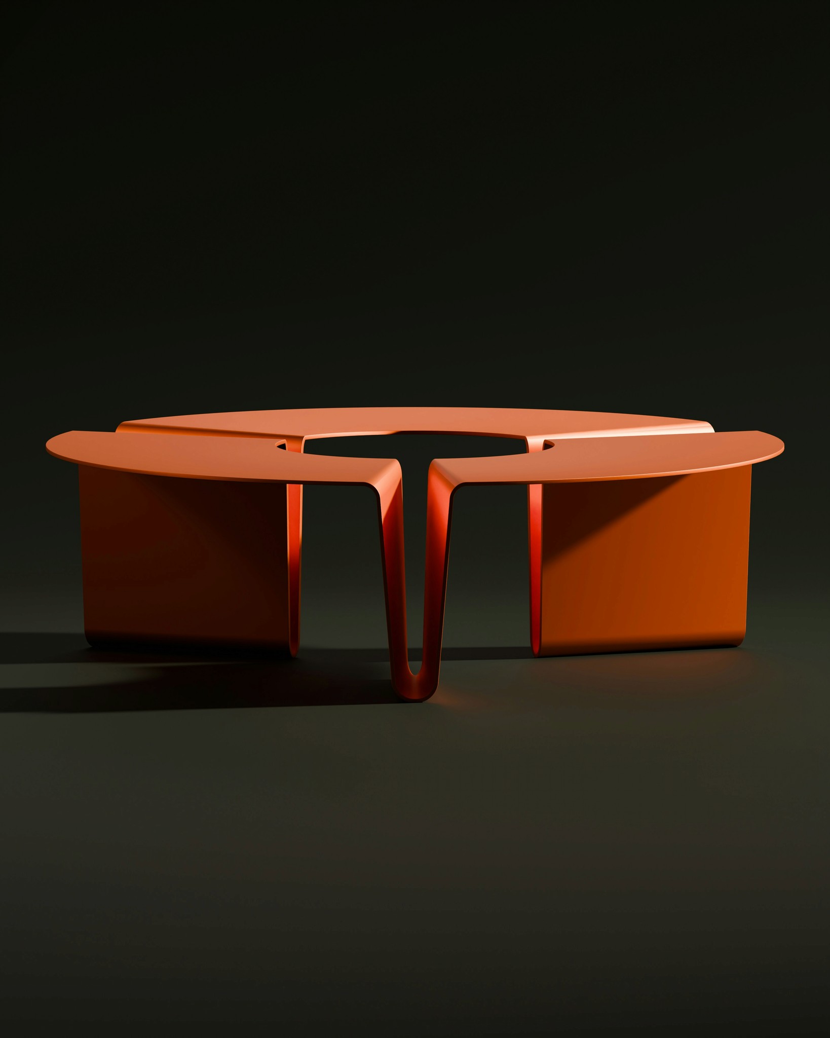A modern orange table stands against a dark backdrop.
