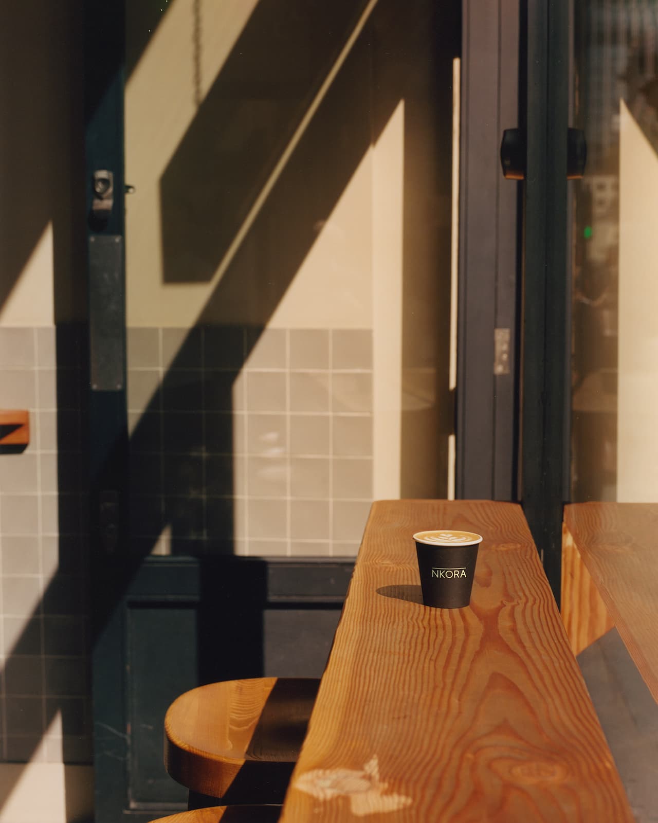 Coffee Cup and Indoor Seatings - NKORA London Wall Coffee Shop