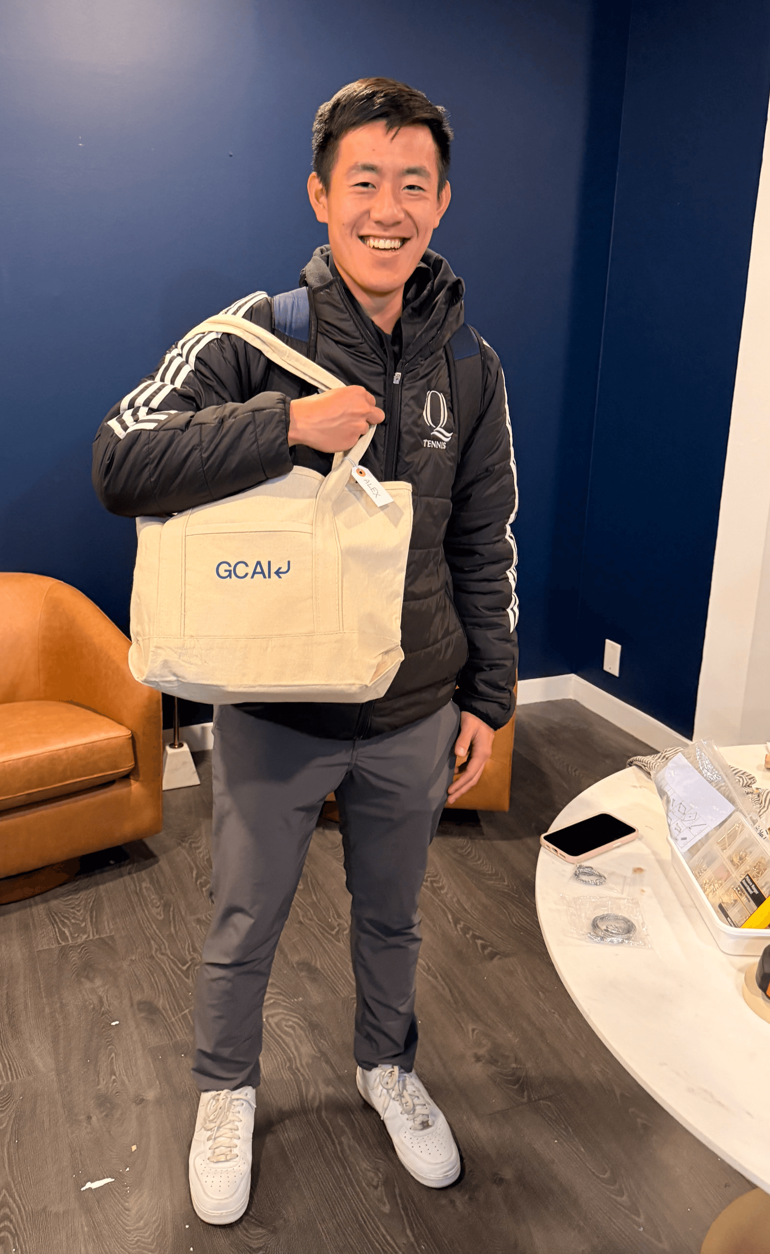 GC AI employee with GC AI merch bag